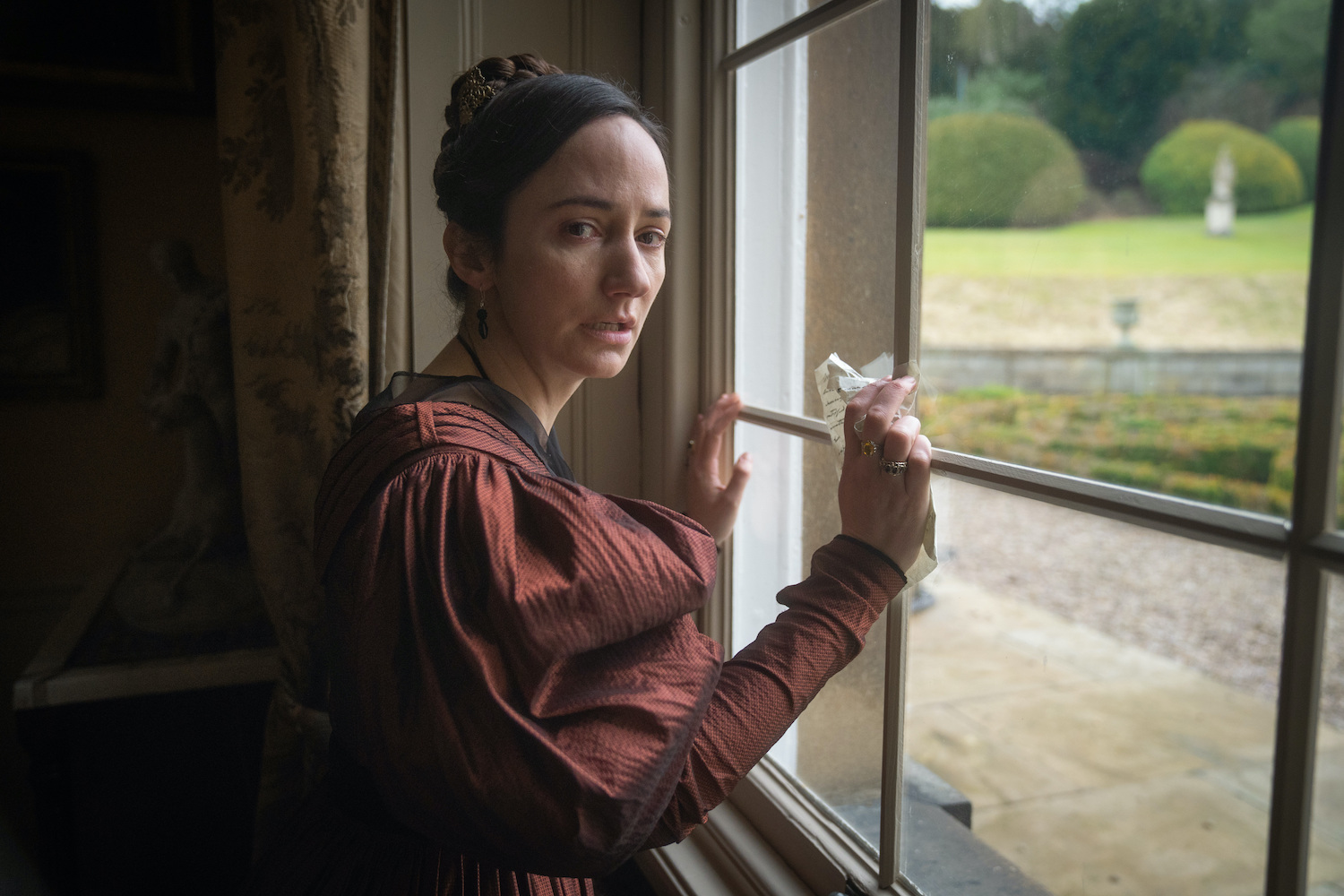 Anne Lister's ex Marianna poses against a window looking pained