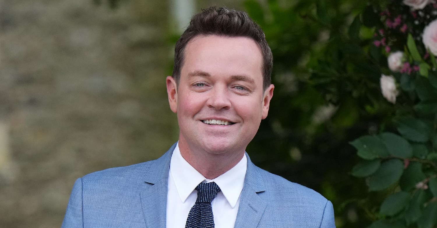 Stephen Mulhern smiles in blue suit and tie