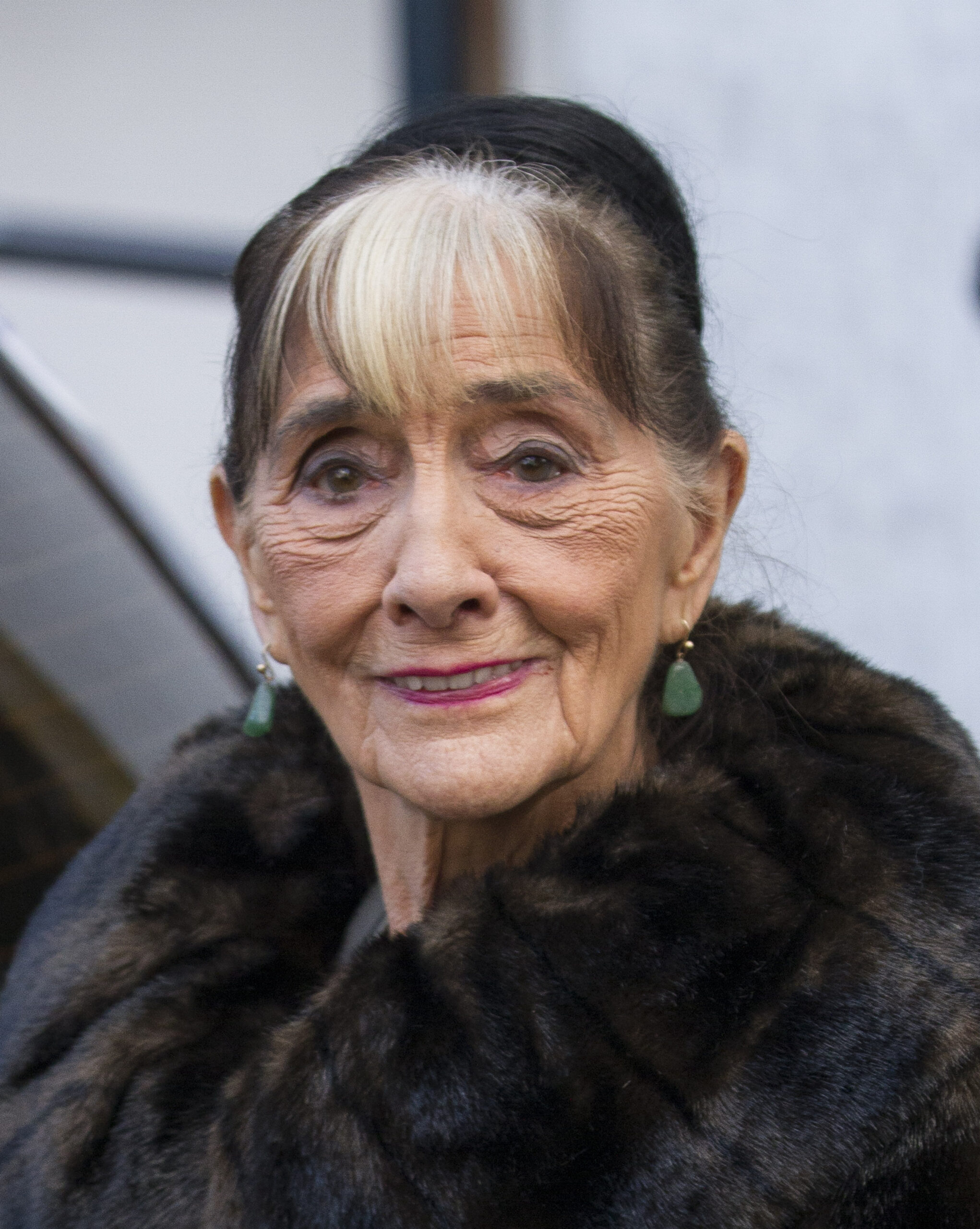 June Brown smiles in fur coat outside ITV Studios