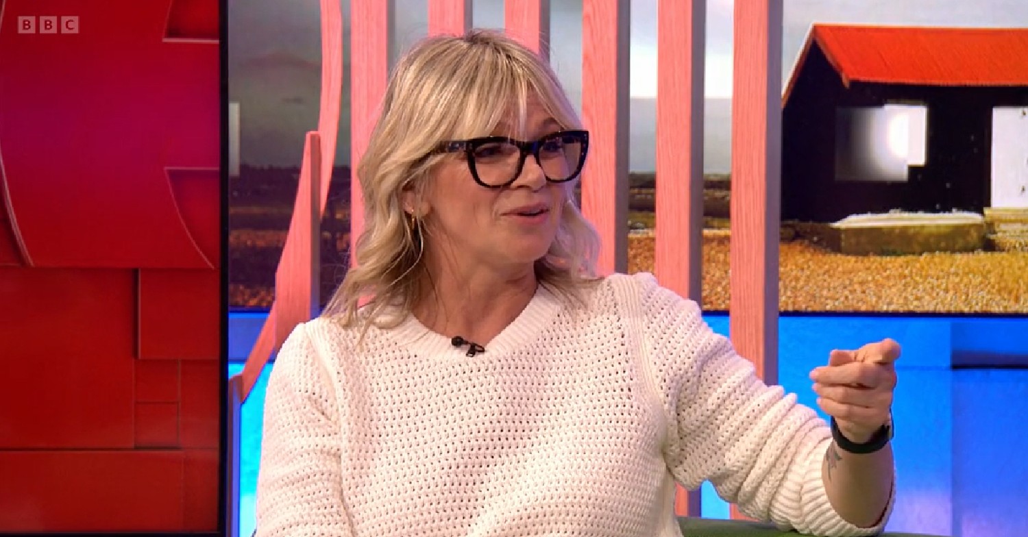 Zoe Ball wearing white jumper and glasses on The One Show April 8, 2022