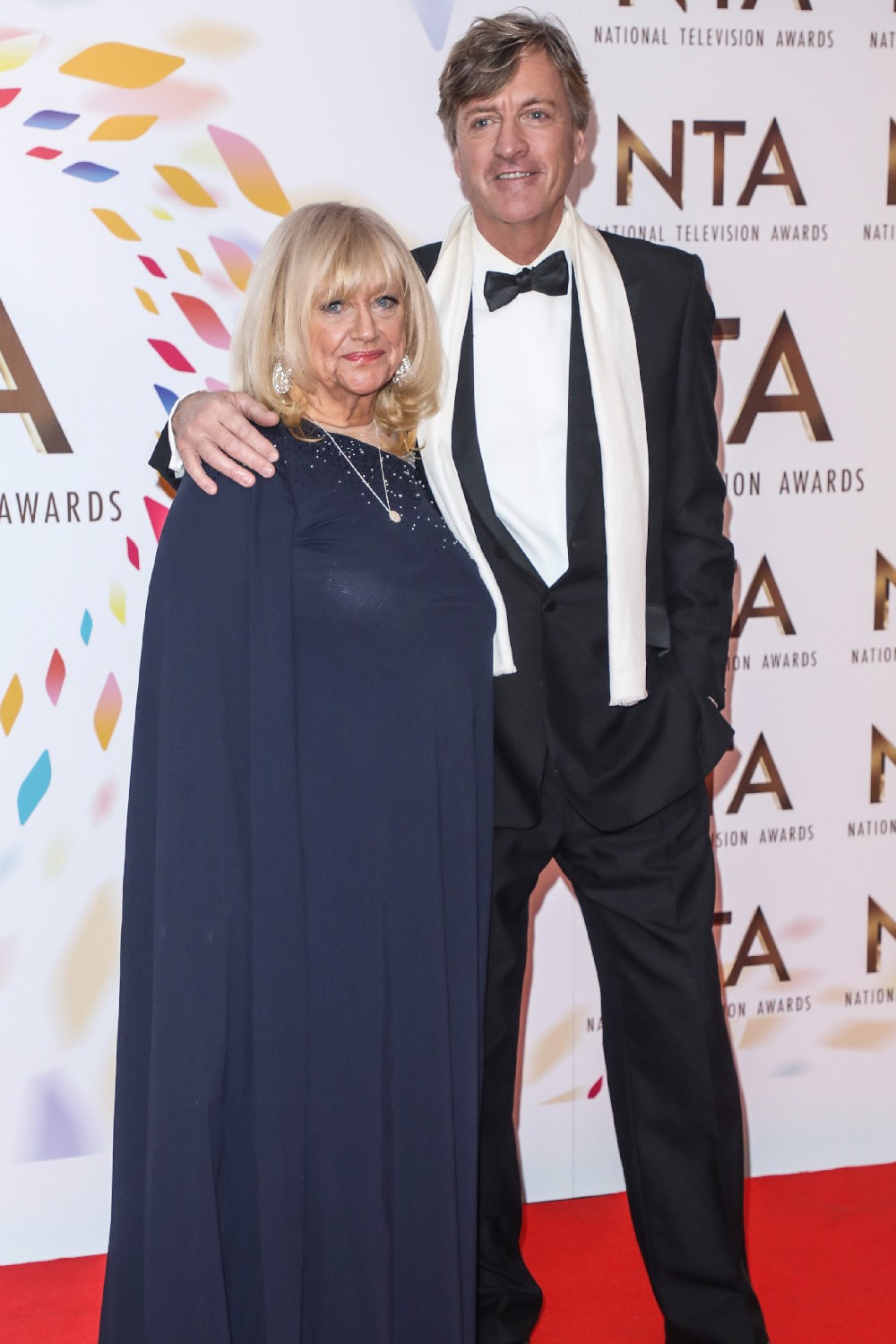 Richard Madeley with his arm around Judy Finnigan at NTAs
