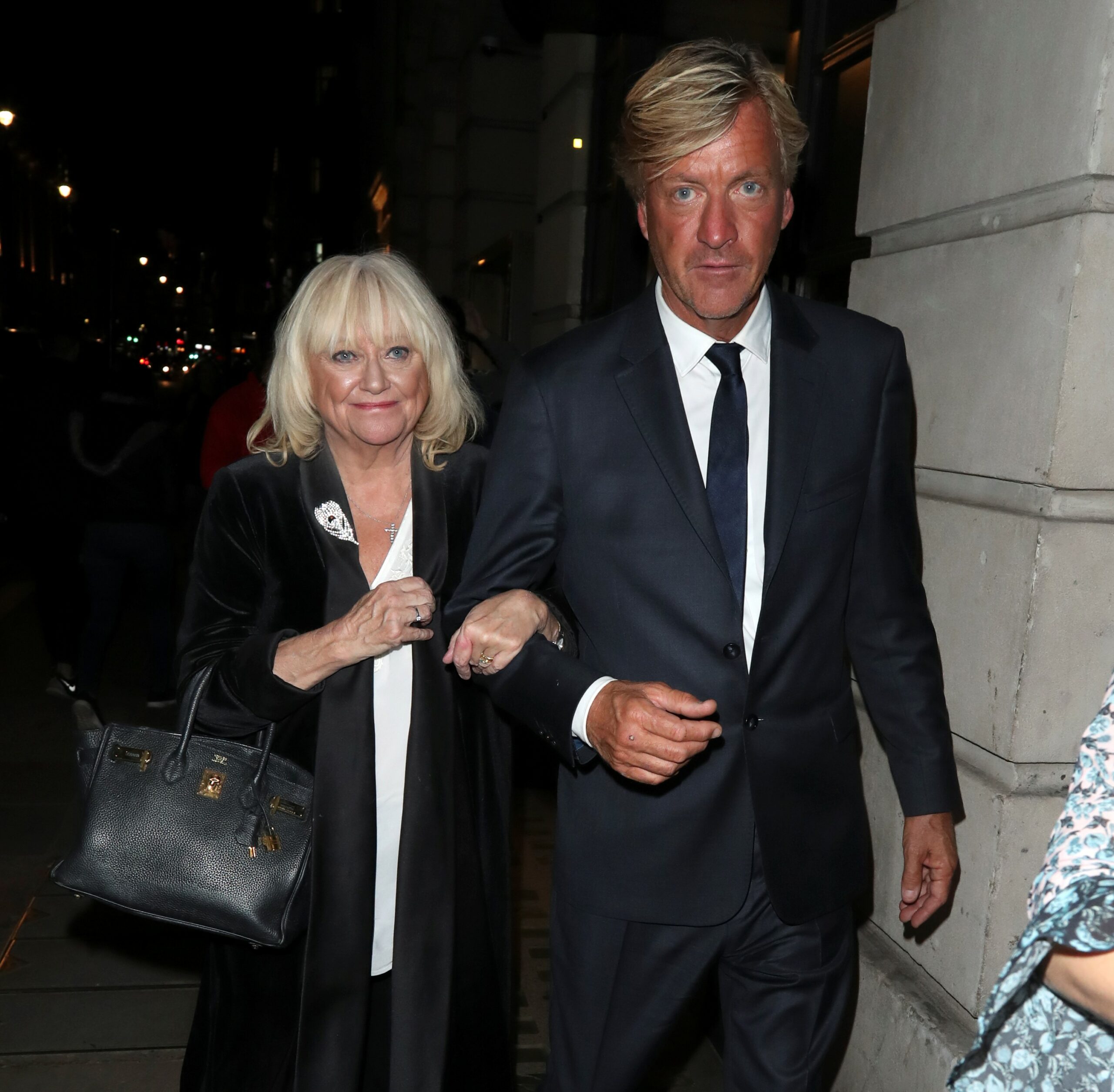Judy Finnigan walking arm in arm with Richard Madeley