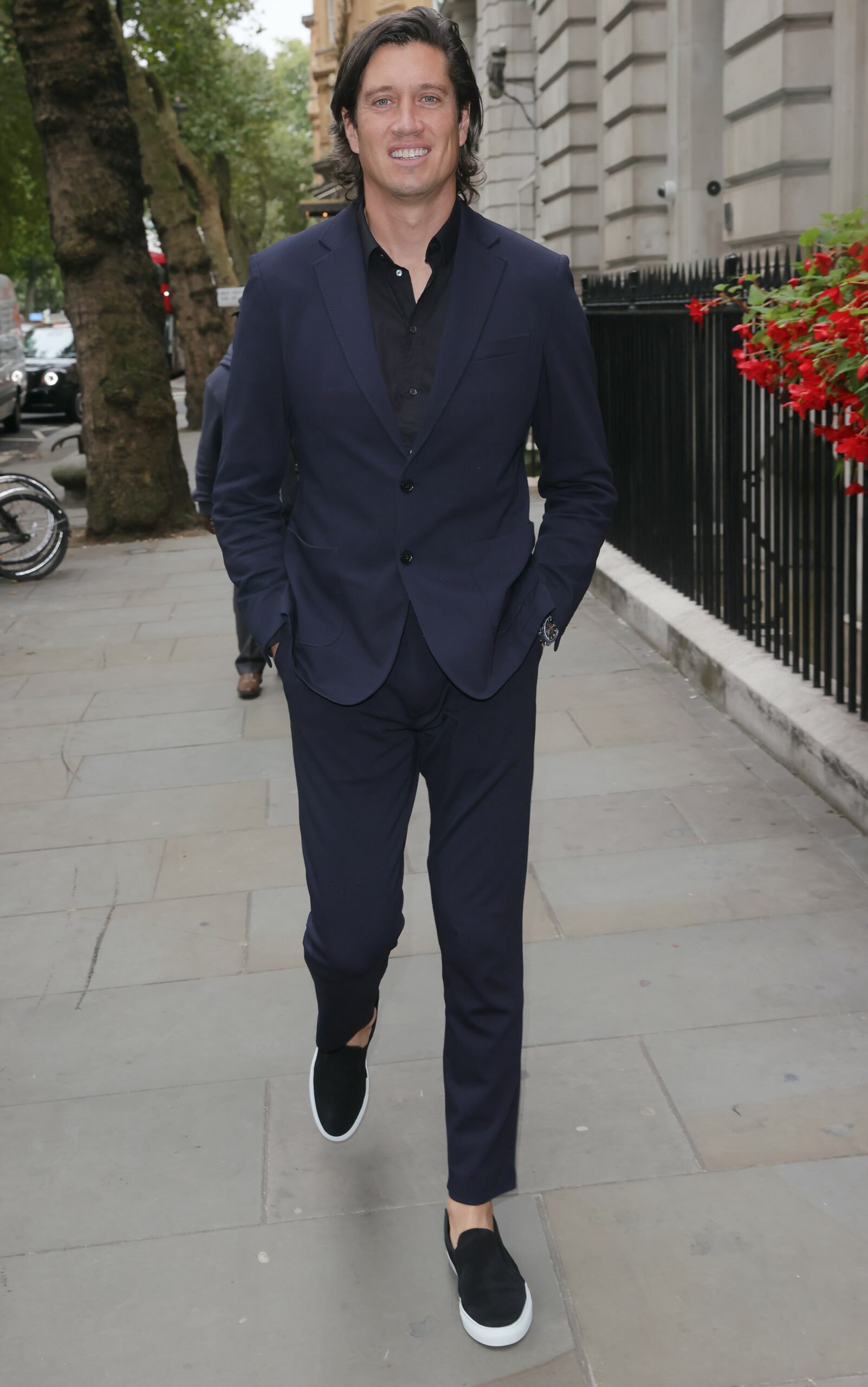 Vernon Kay in navy suit as he arrives at At The TRIC Awards