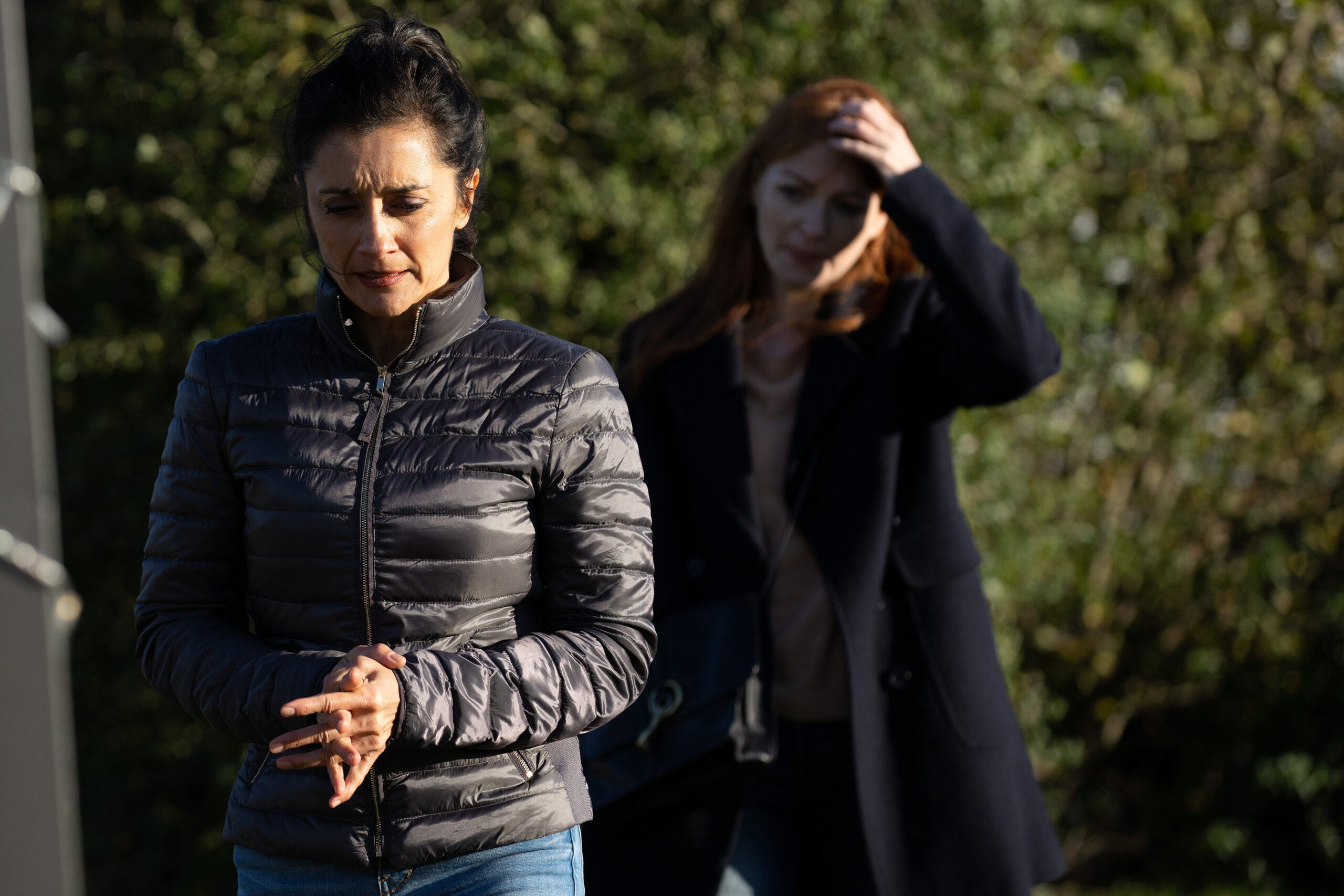 Manpreet looking upset with Carol stood behind her in Emmerdale 