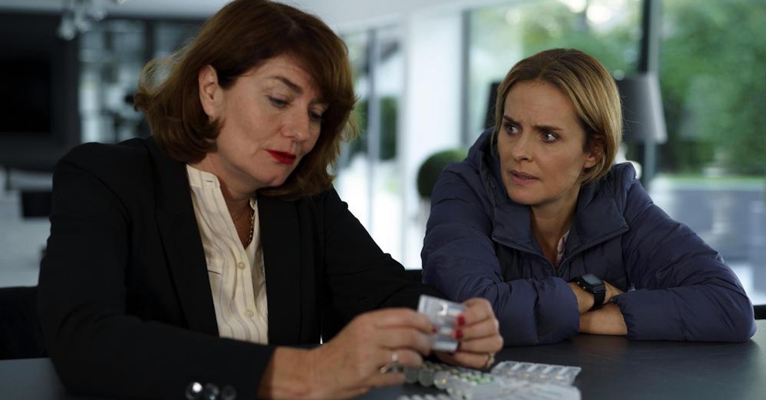 Sasha and Jenny in Compulsion on Channel 5 looking very serious over a table of pills