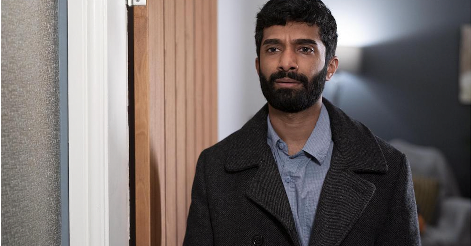 Chris in Compulsion on Channel 5 standing in a doorway looking suspiciously at something