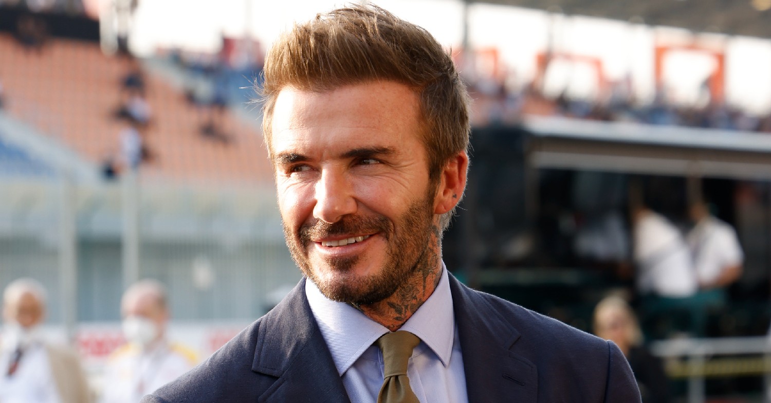 David Beckham smiling in suit
