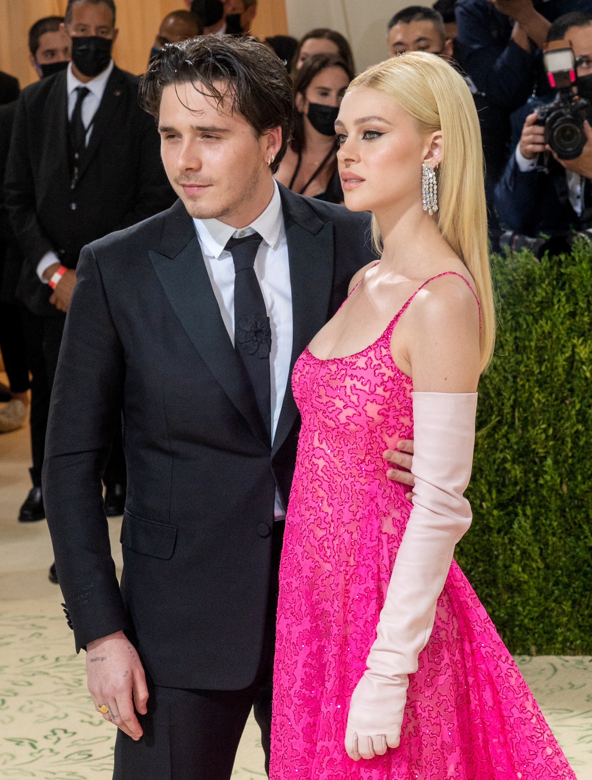 Brooklyn Beckham and Nicola Peltz pose for cameras at Met Gala