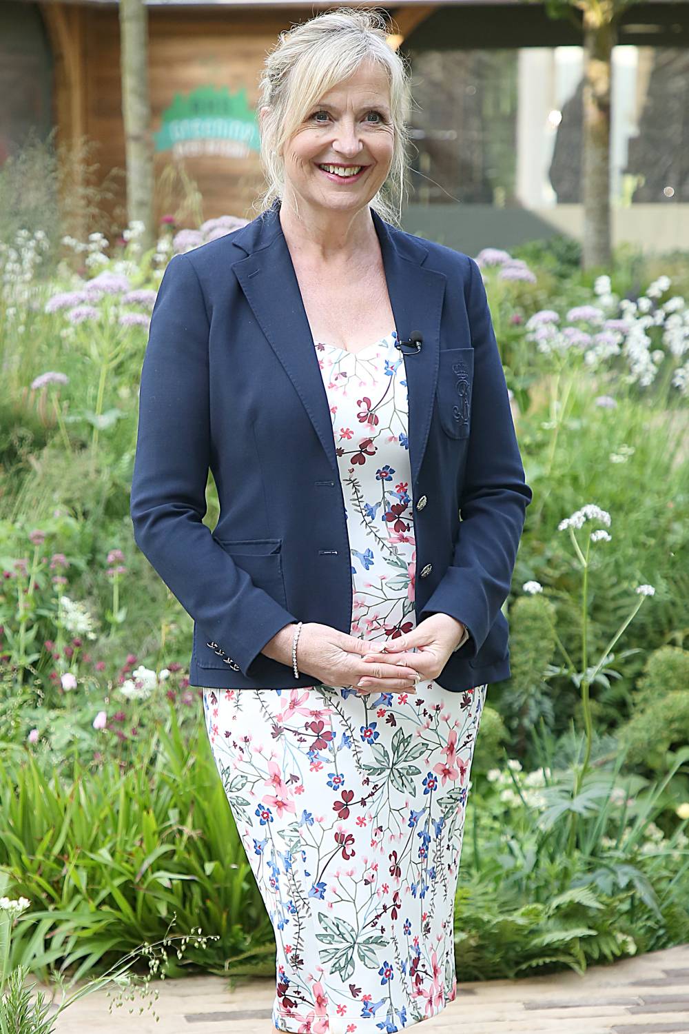 Carol Kirkwood smiling in a floral dress