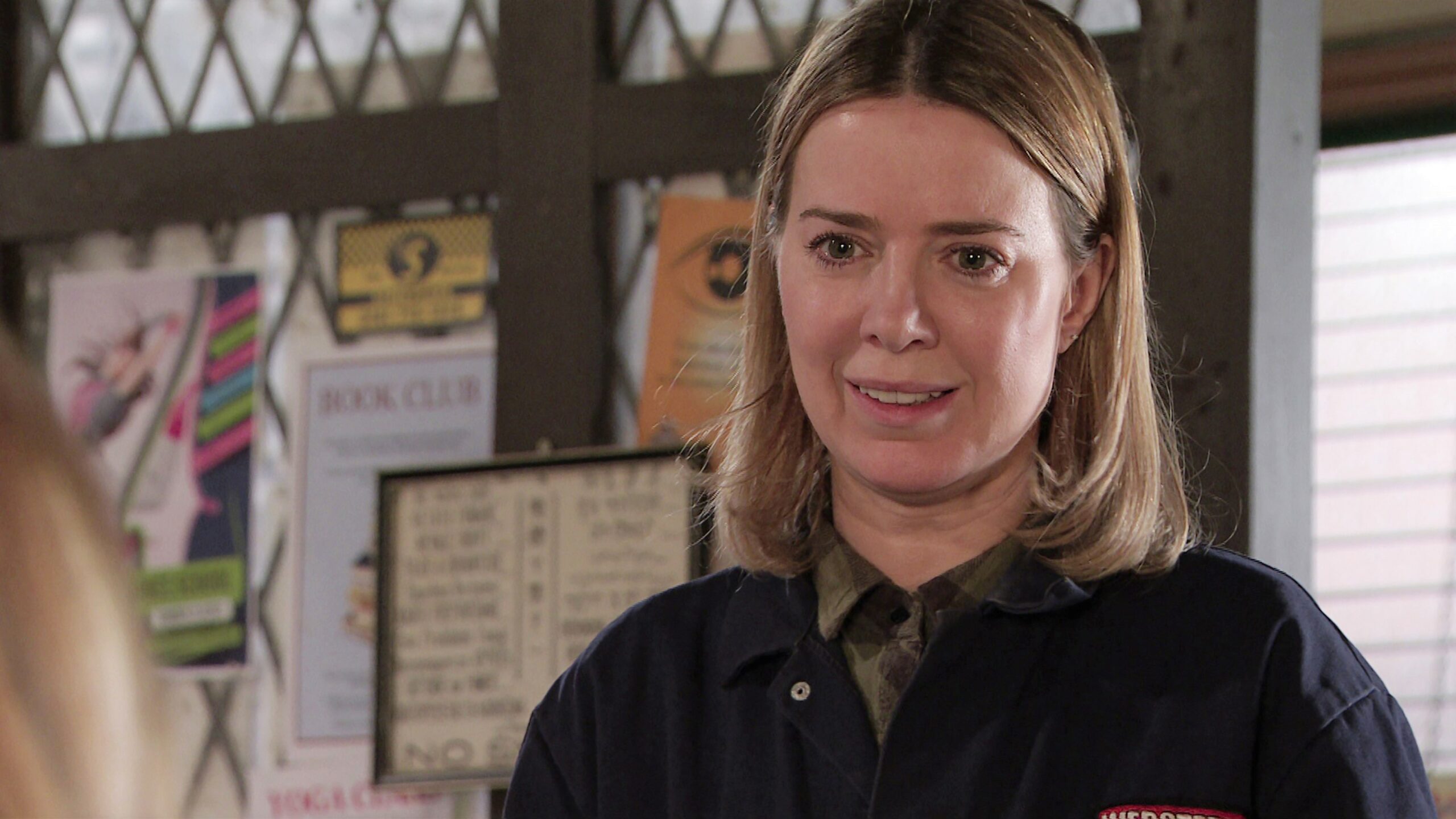 Abi looking worried in Coronation Street