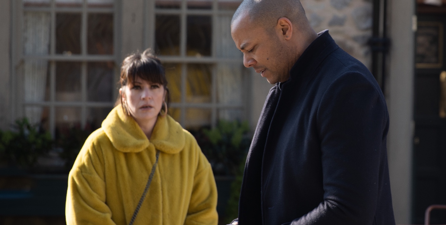 Emmerdale Al on phone as Kerry looks on