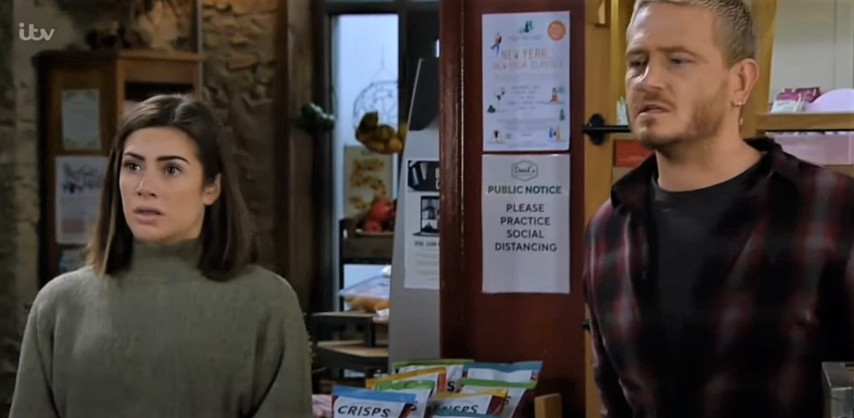 Victoria Sugden and David Metcalfe look worried after being given news of Meena