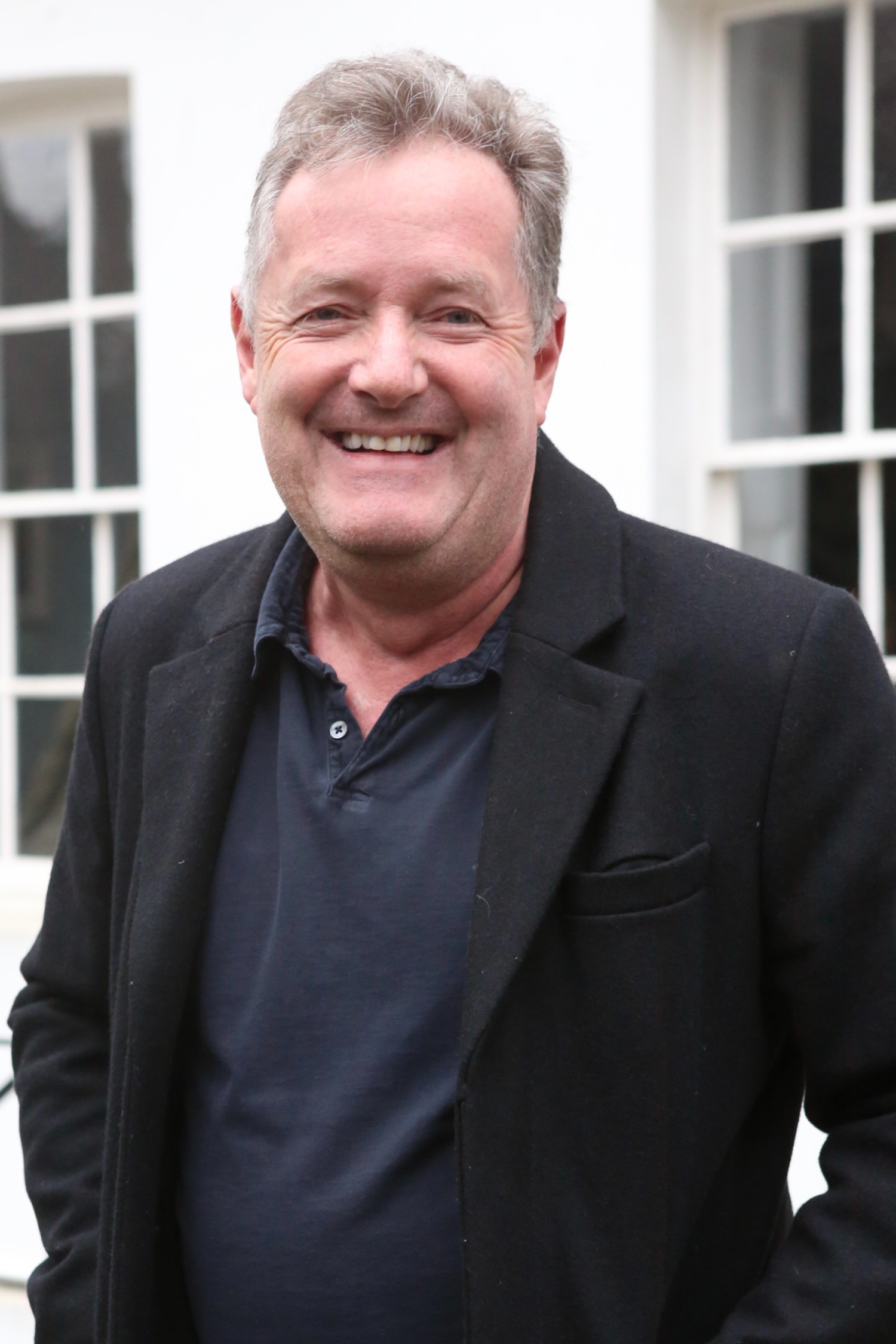 Piers Morgan smiling at the camera