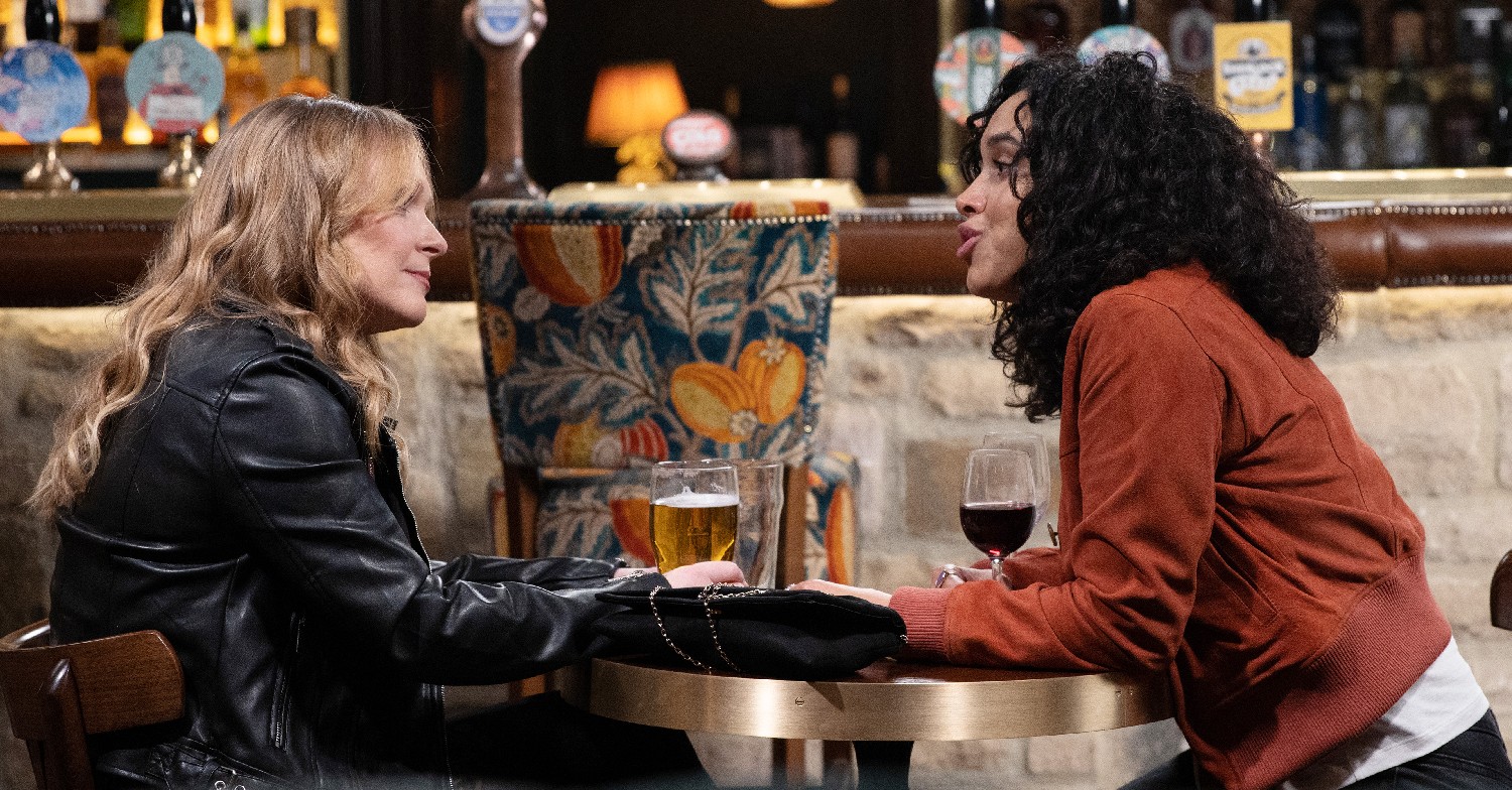 Emmerdale Vanessa and Suzy on a date sitting at table