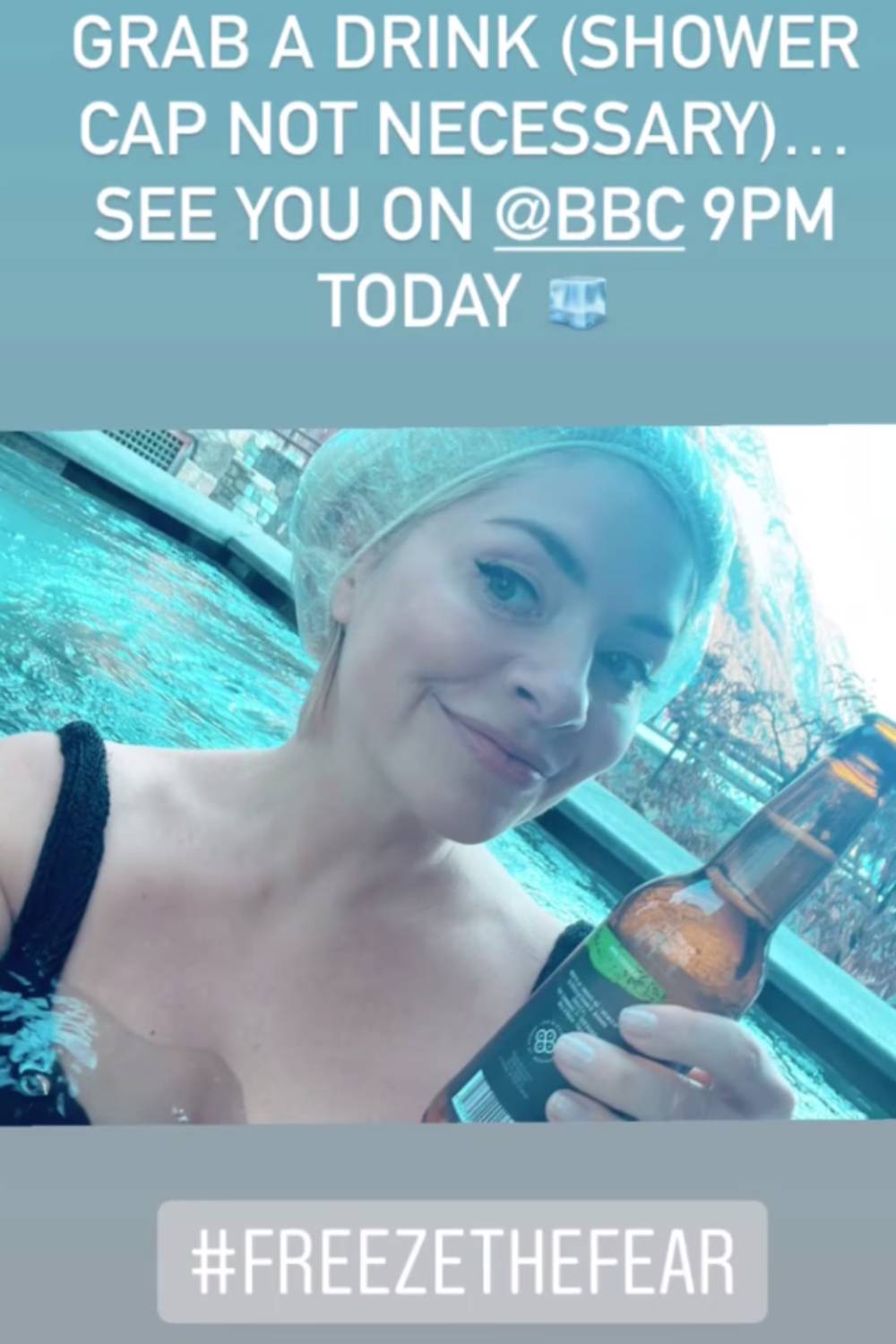 Freeze The Fear host Holly Willoughby holds a beer in a hot tub