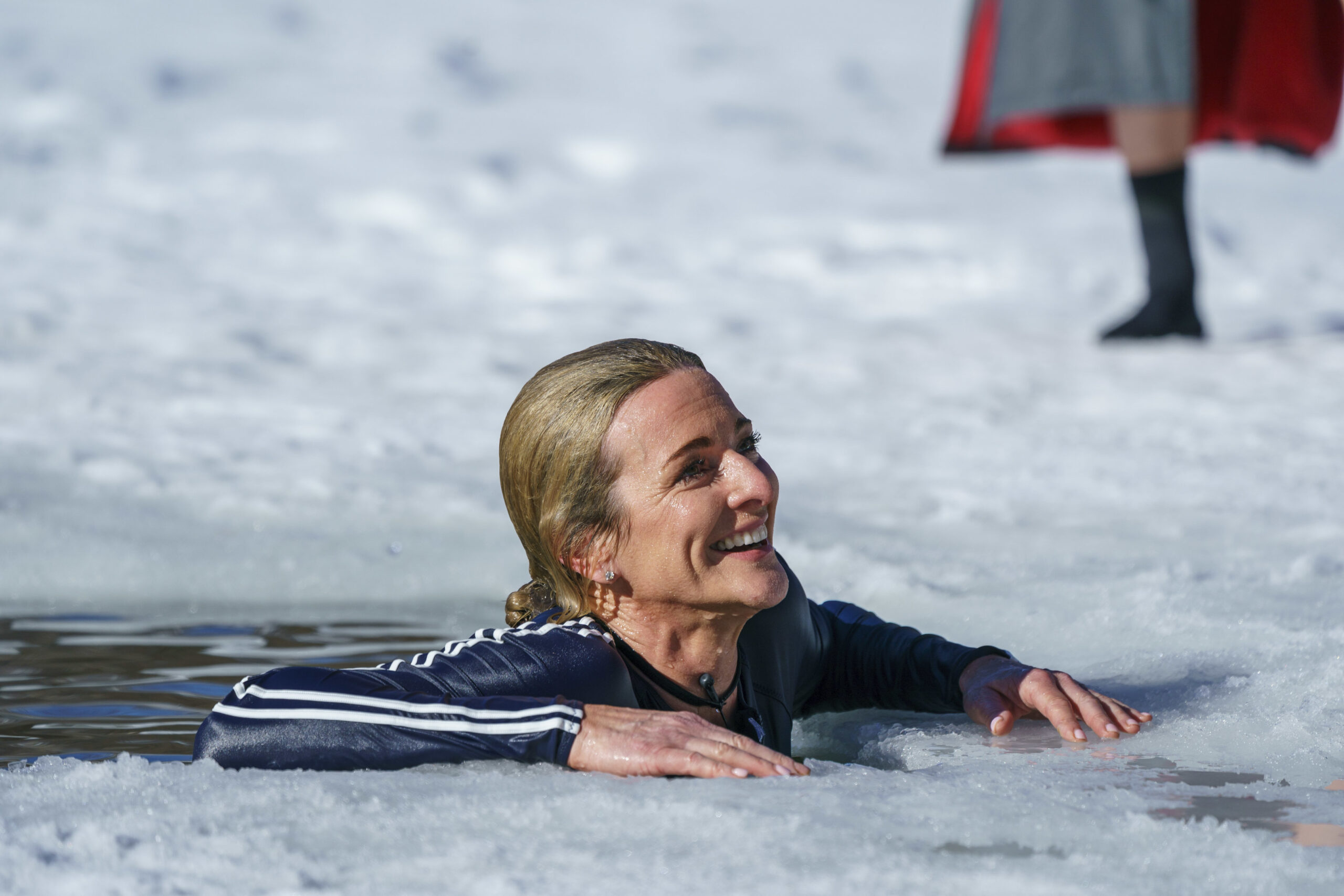 Gabby Logan grins from the icy water on Freeze The Fear