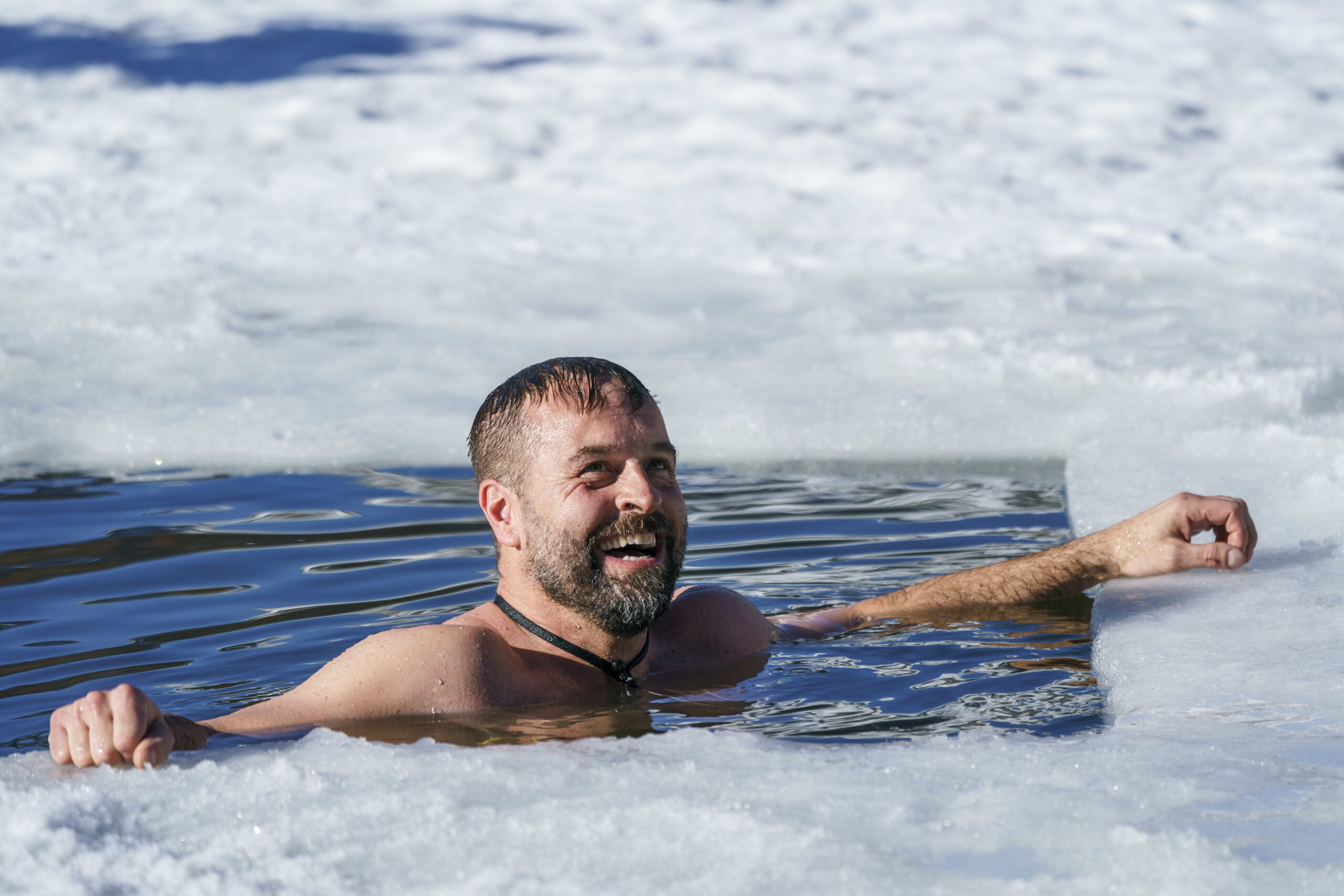Alfie Boe grins from the freezing waters on Freeze The Fear