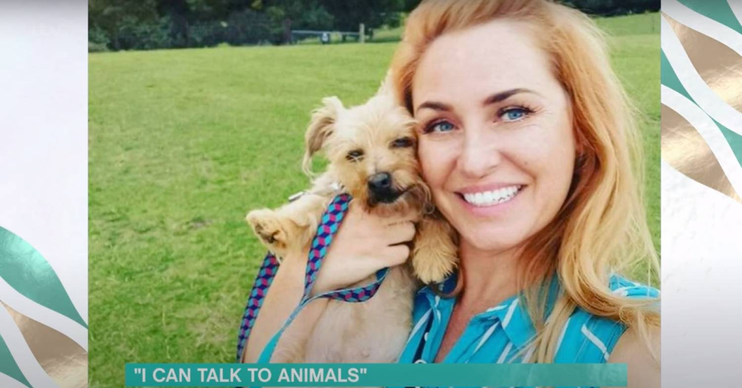 Josie Gibson holds her dog