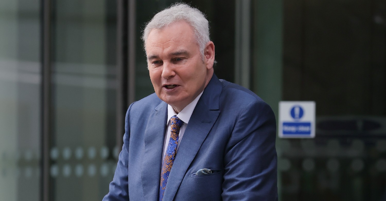 Eamonn Holmes struggling to walk wearing a suit
