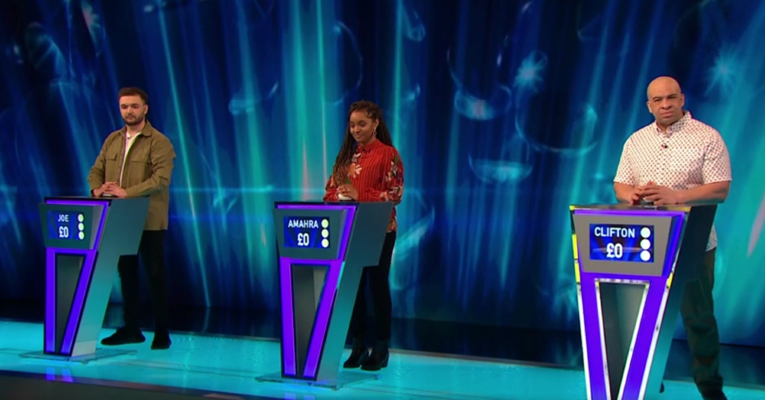Three contestants smiling on Tipping Point