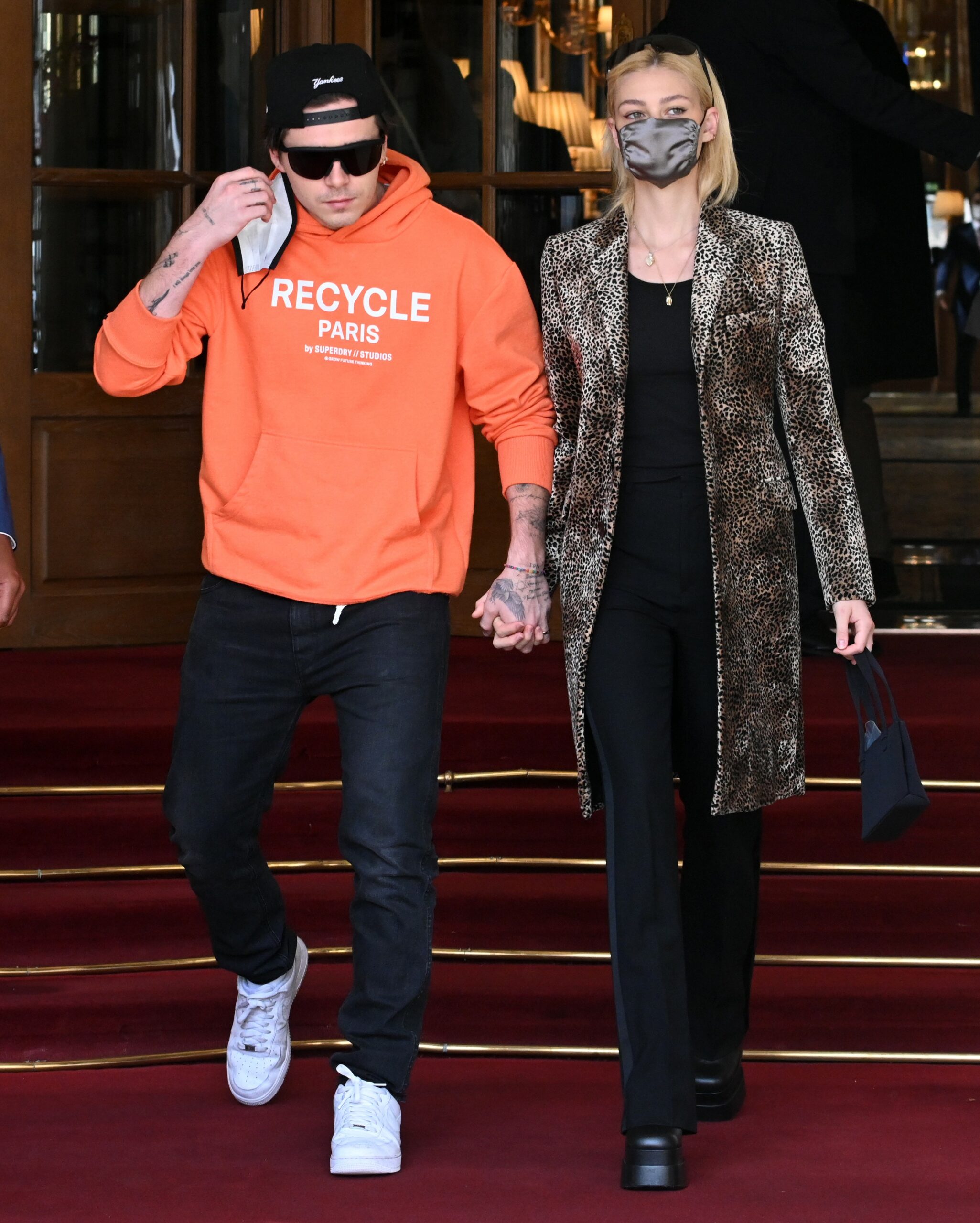 Brooklyn Beckham and Nicola Peltz holding hands while out in France