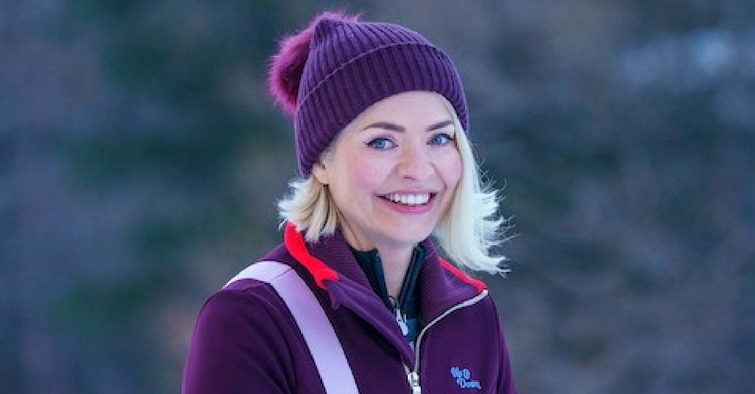 Holly Willoughby grinning in a woolly hat on Freeze the Fear set on BBC One (Credit: BBC)
