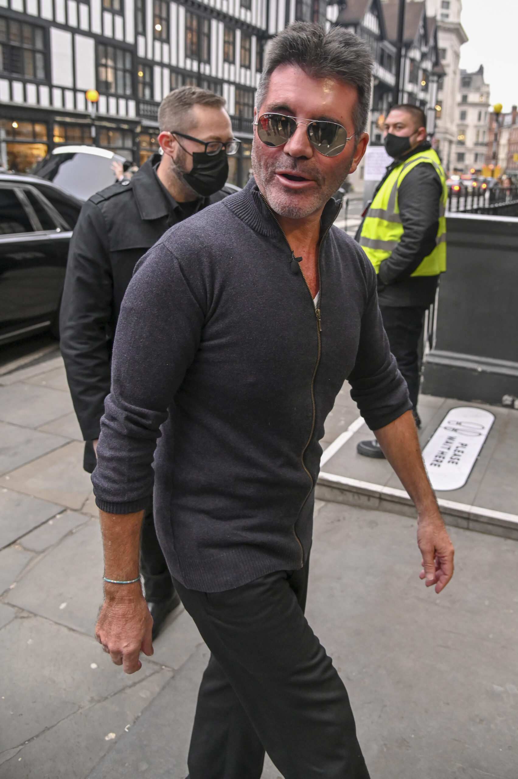 Simon Cowell looks towards cameras with sunglasses on at BGT auditions