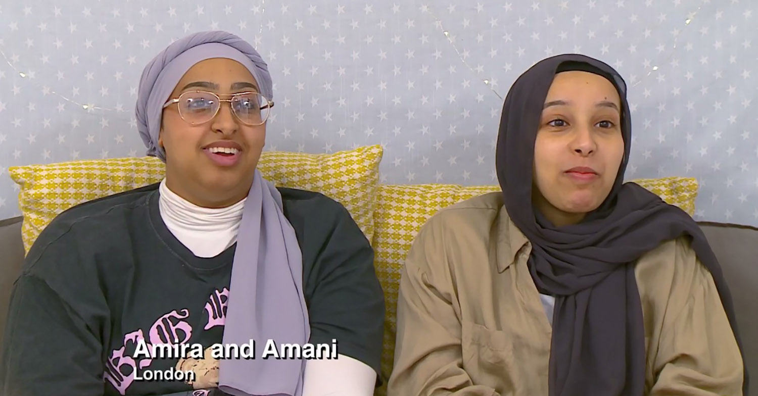 Amira and Amani smiling watching telly on Gogglebox