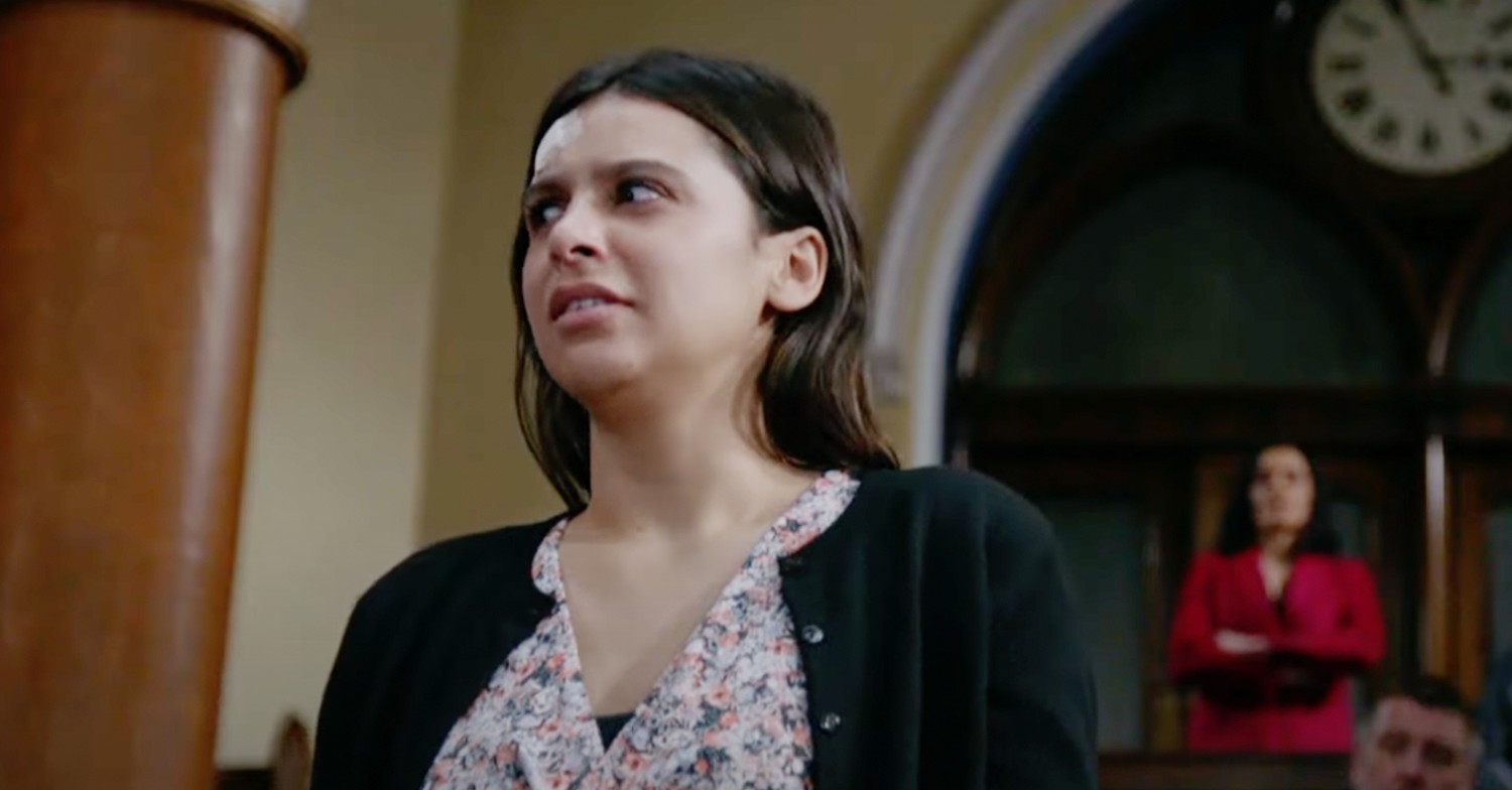 Meena in Emmerdale looks sideways in confusion