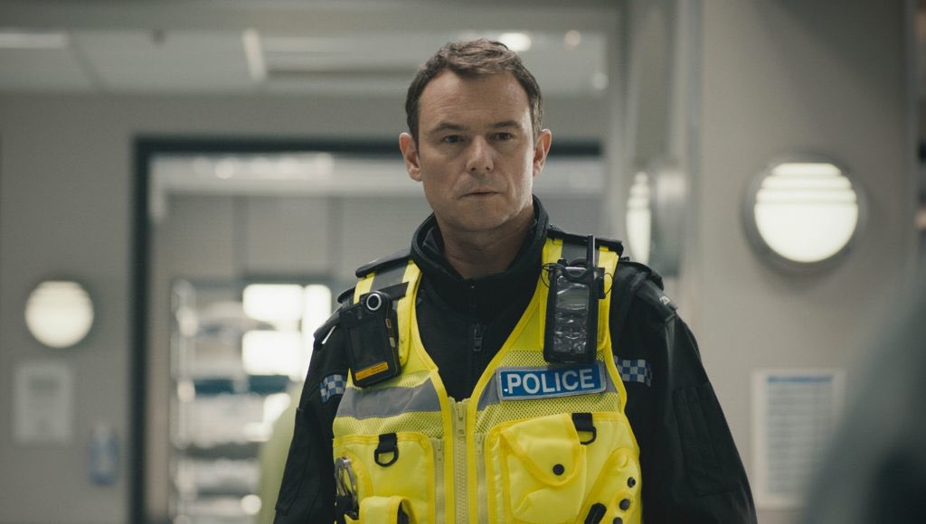 Andrew Lancel in hi-vis vest playing another man of the law in Casualty 