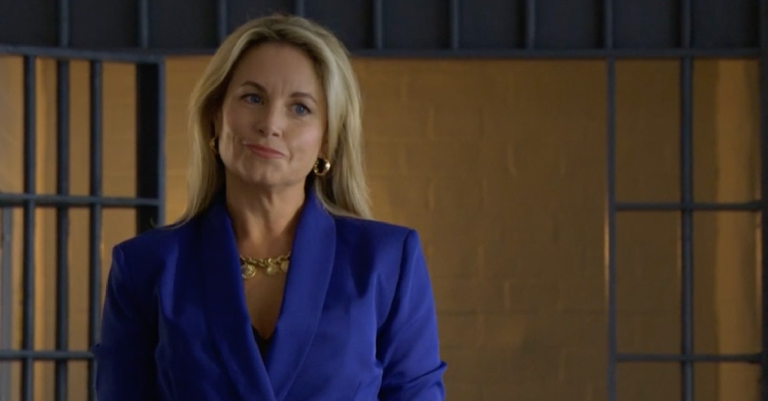 Sam Mitchell smiles at Phil as she arrives at the prison in EastEnders