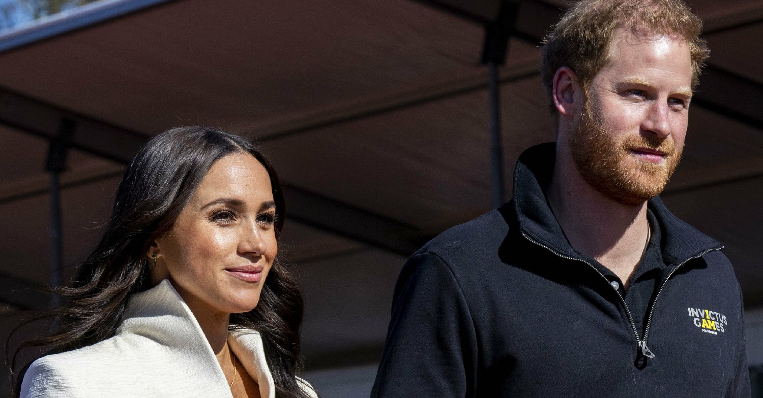 Meghan Markle and Prince Harry smile during Invictus Games 2022