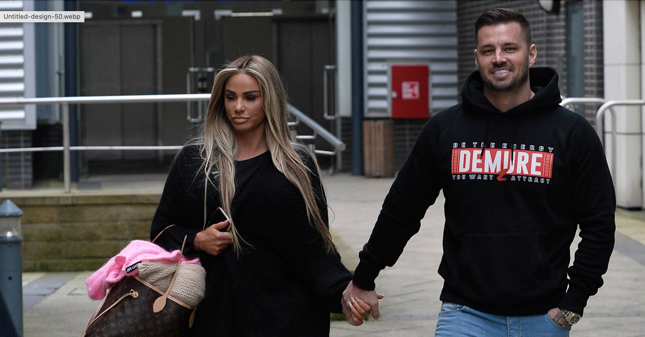 Katie Price and Carl Woods holding hands