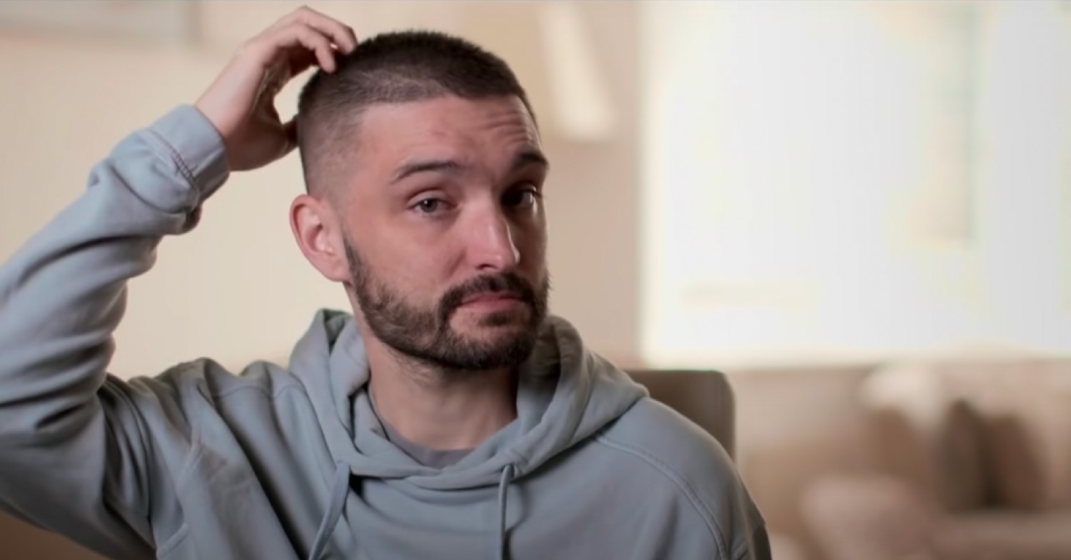 Tom Parker touches head as he talks about cancer battle