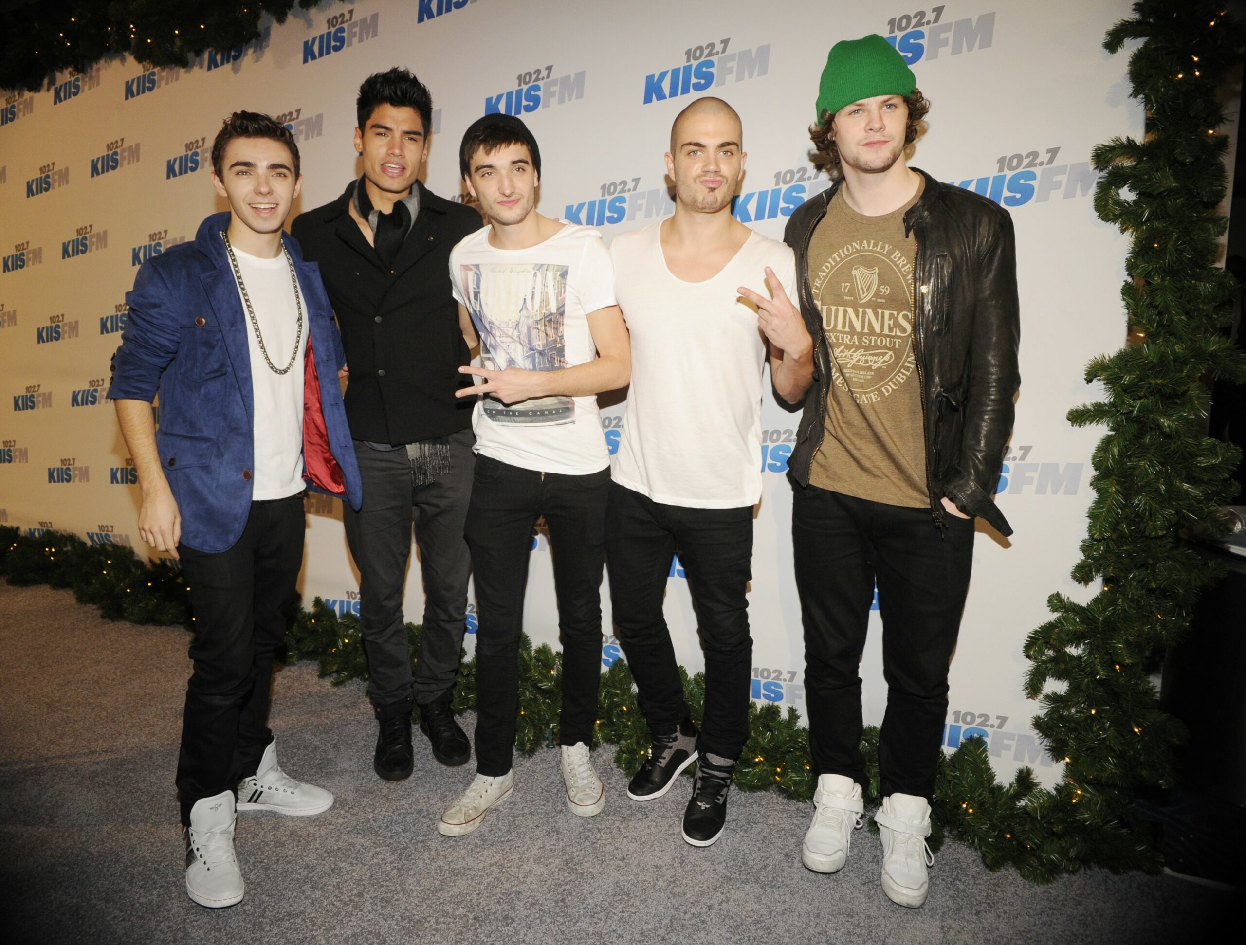 Tom Parker smiles with The Wanted bandmates at event