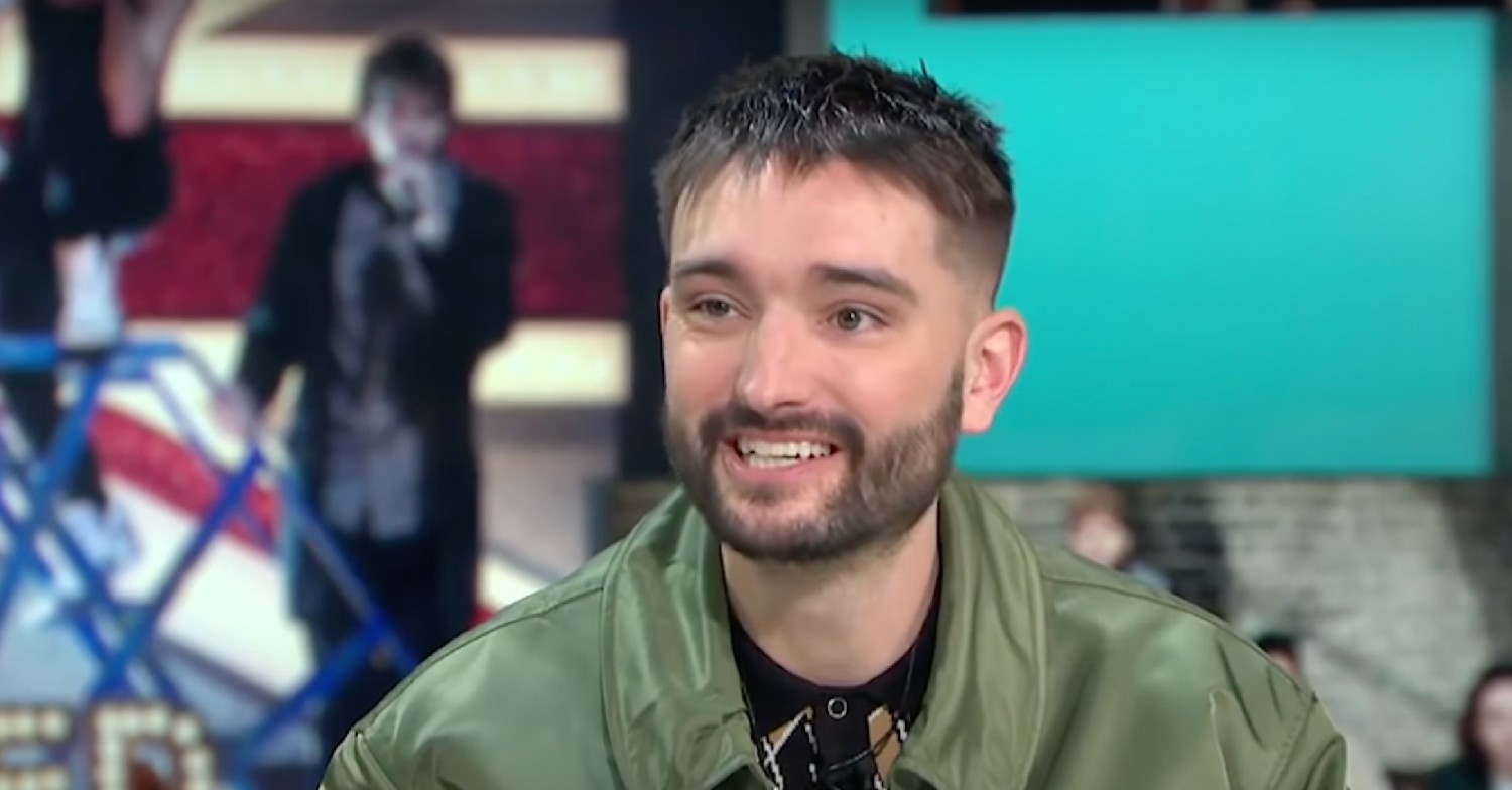 Tom Parker smiling in green jacket on GMB