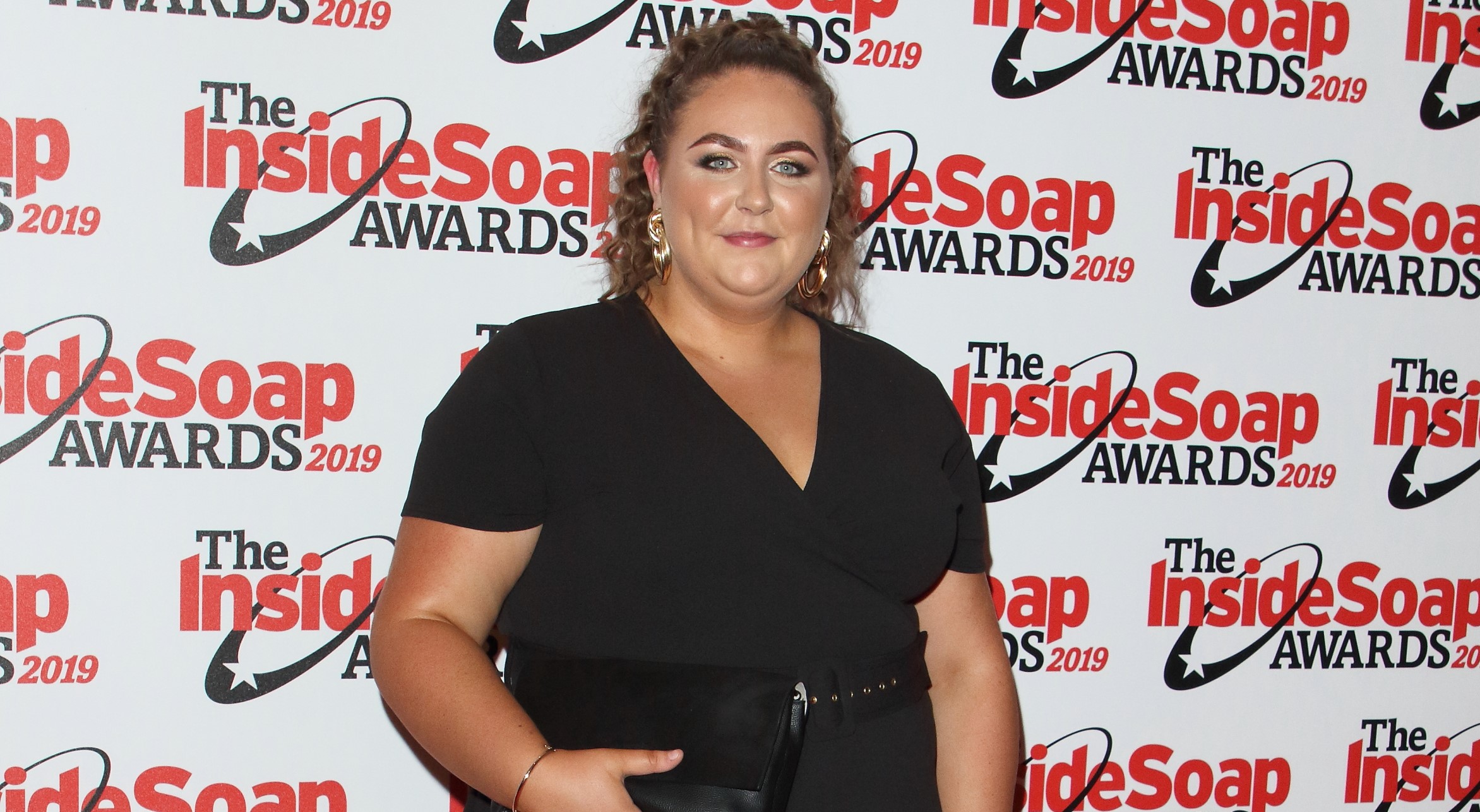 Clair Norris stuns on the red carpet in a black dress at the Inside Soap Awards