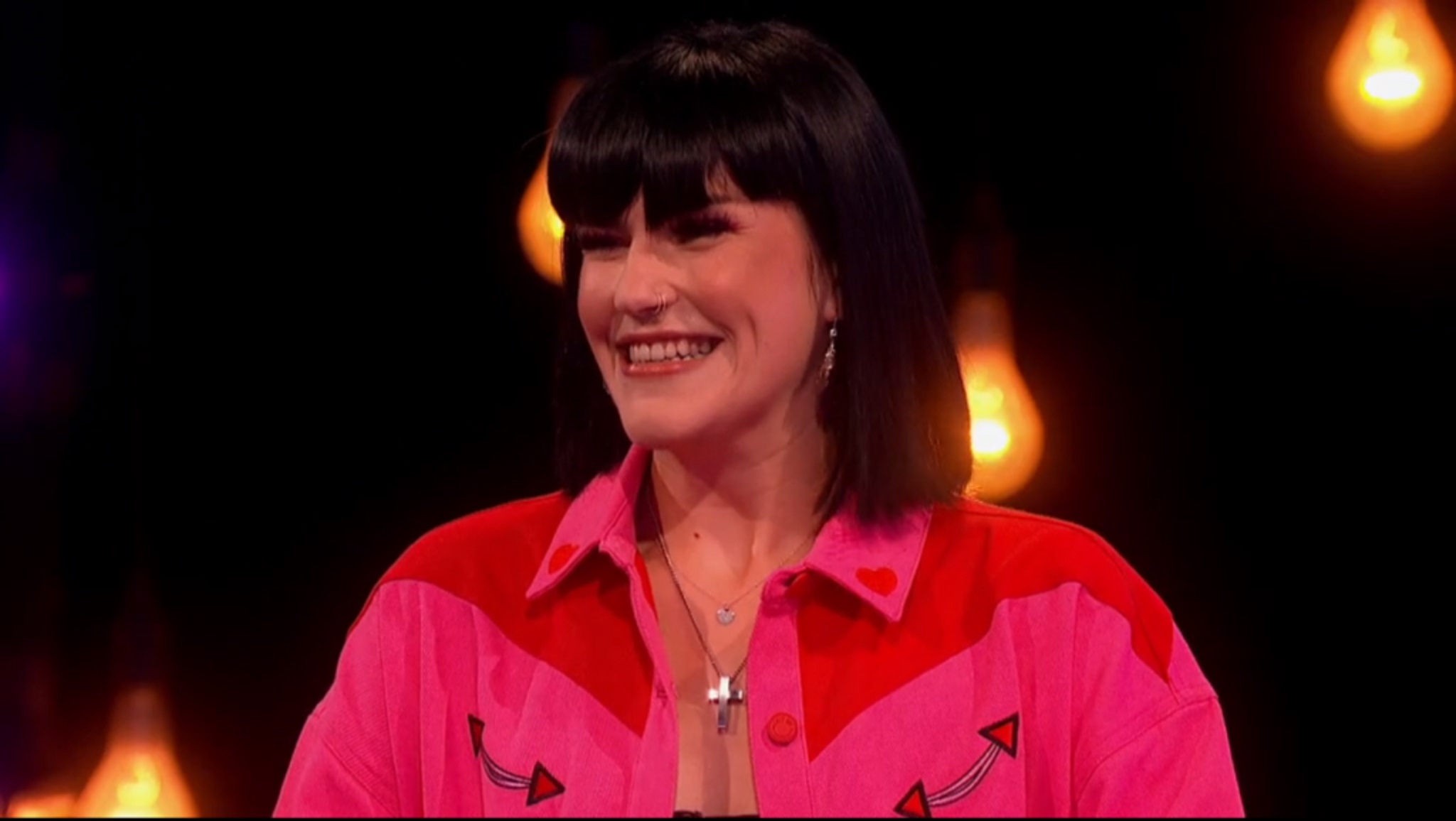 naked attraction contestant wearing a pink shirt and a smile