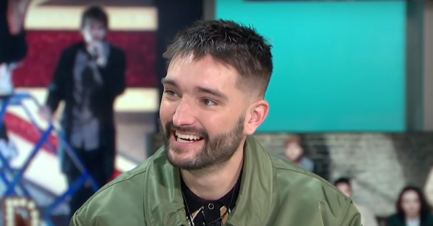 Tom Parker smiling in green jacket on GMB