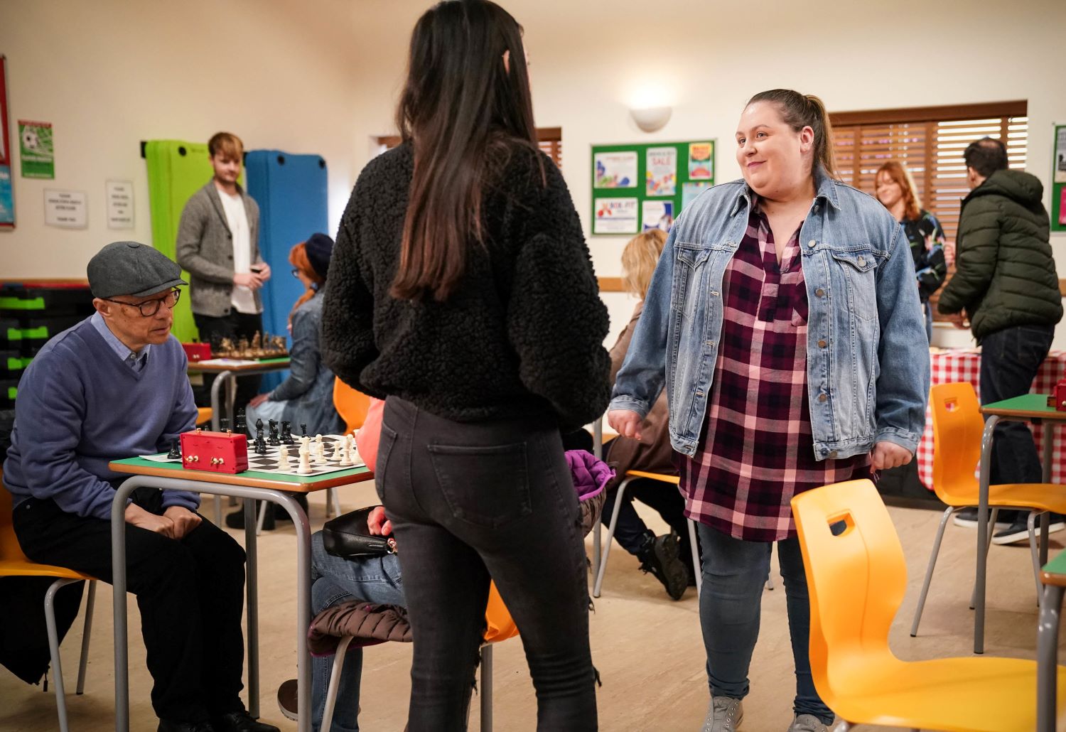Bernie smiles as she brings Dotty to chess club