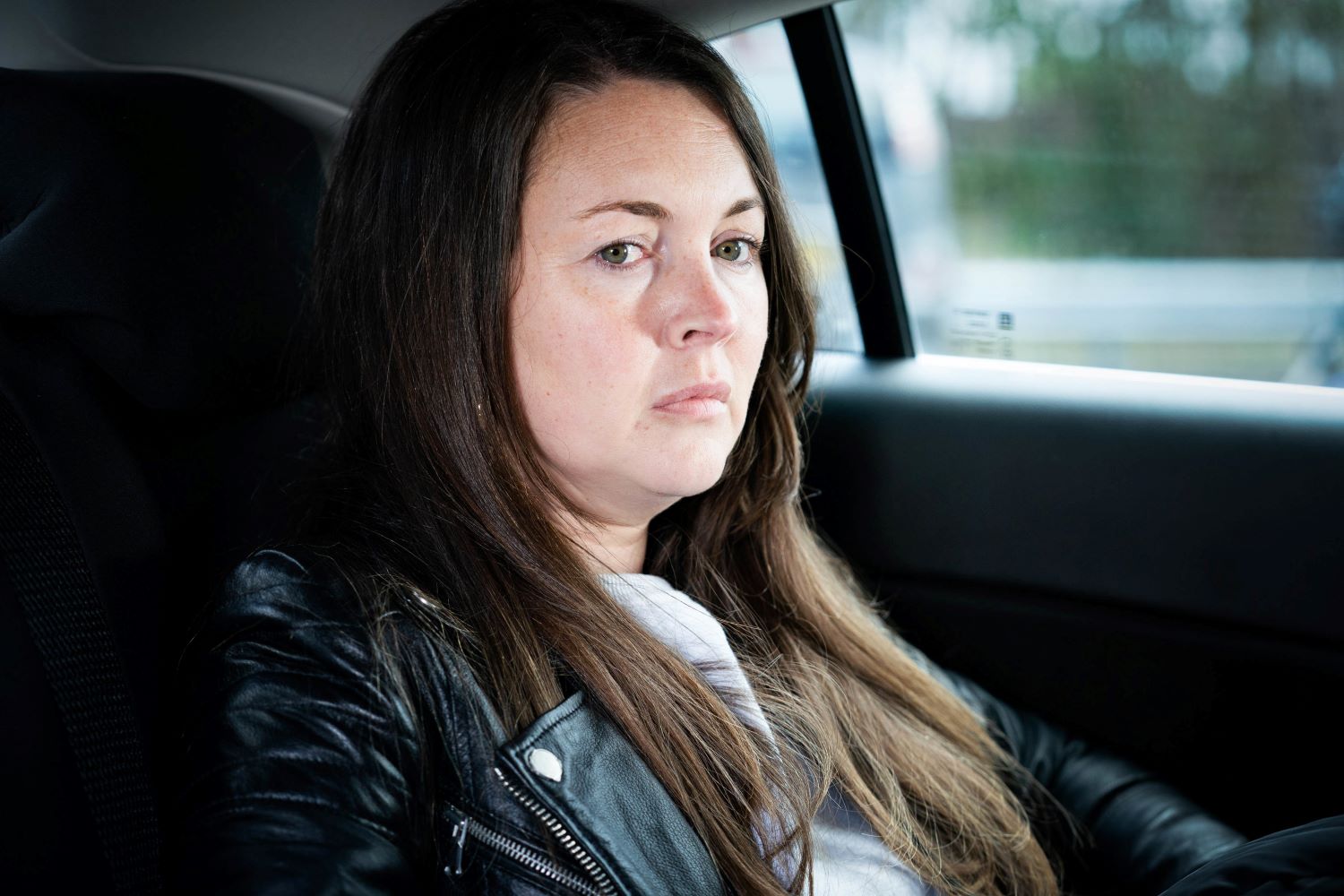 Stacey Slater looks very worried in the back of Harvey's taxi