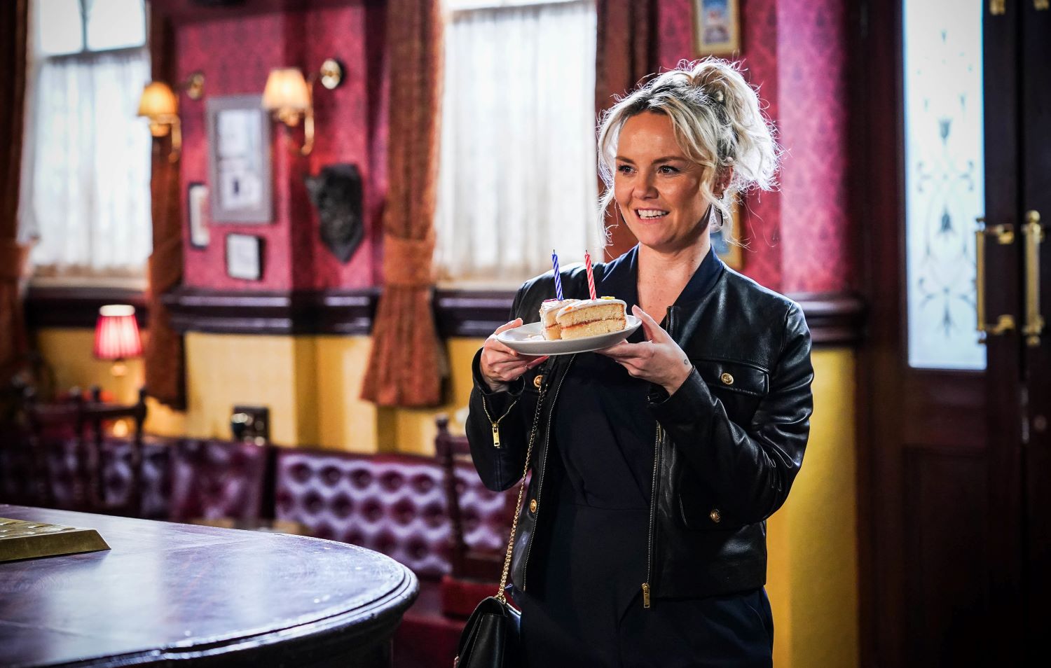 Smiling Janine Butcher brings Mick cake in EastEnders