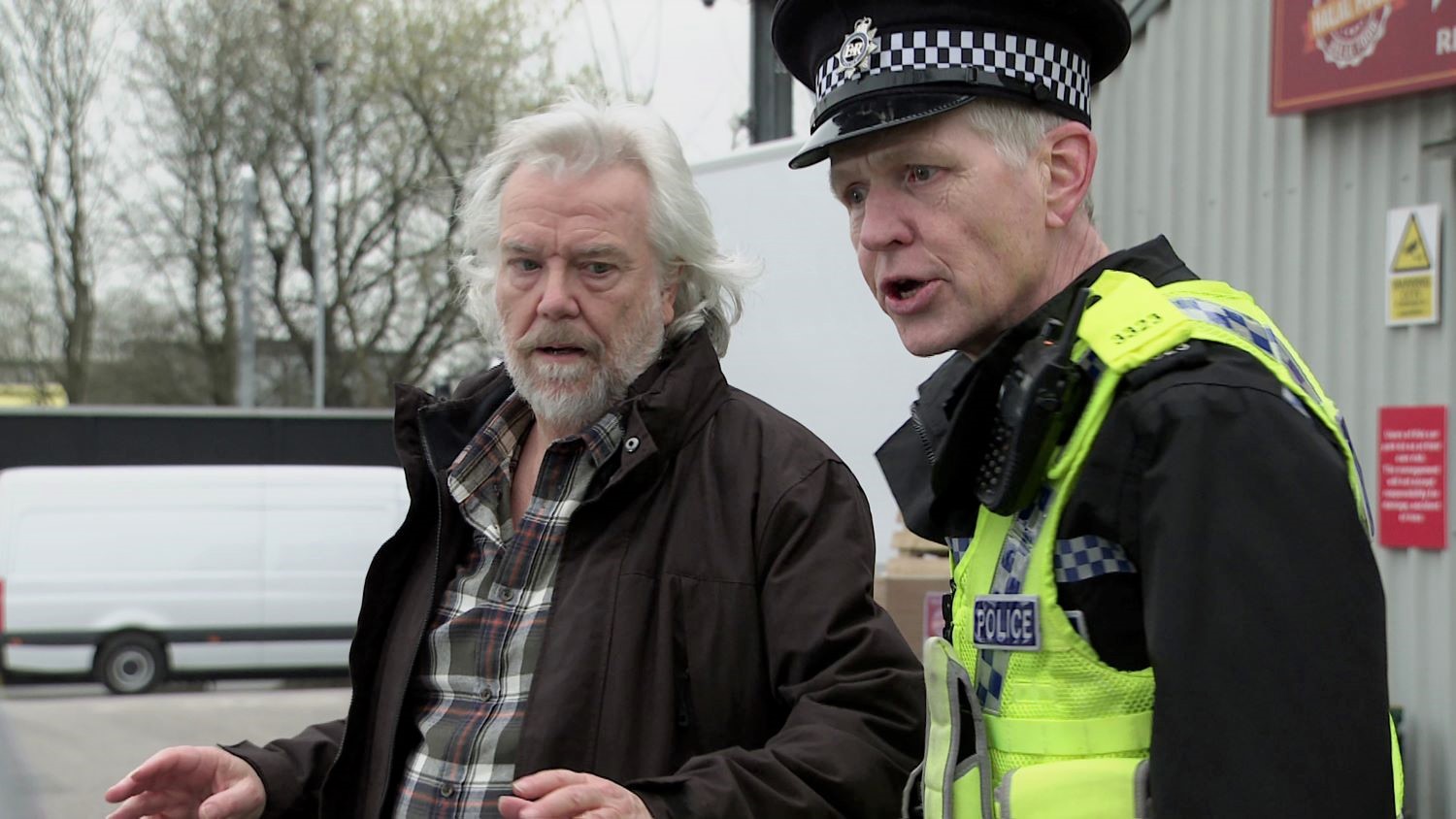 Coronation Street Stu looks worried as he's arrested