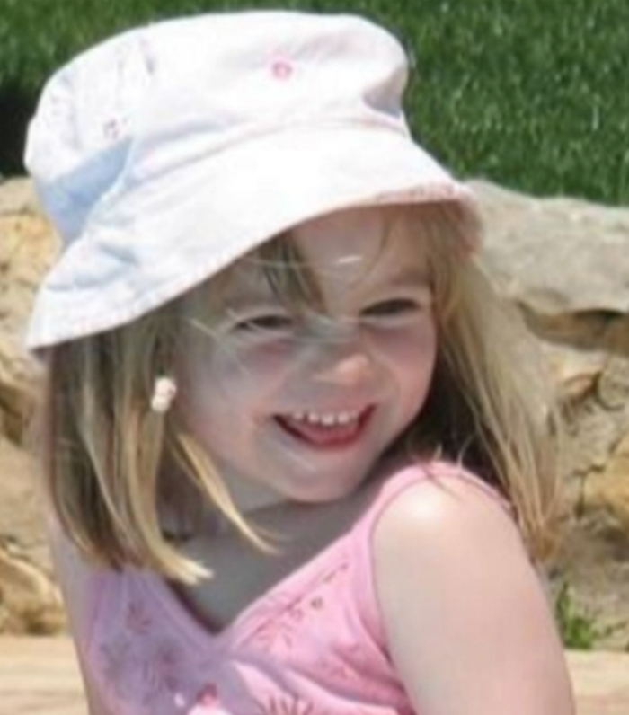 Madeleine McCann smiling wearing pink