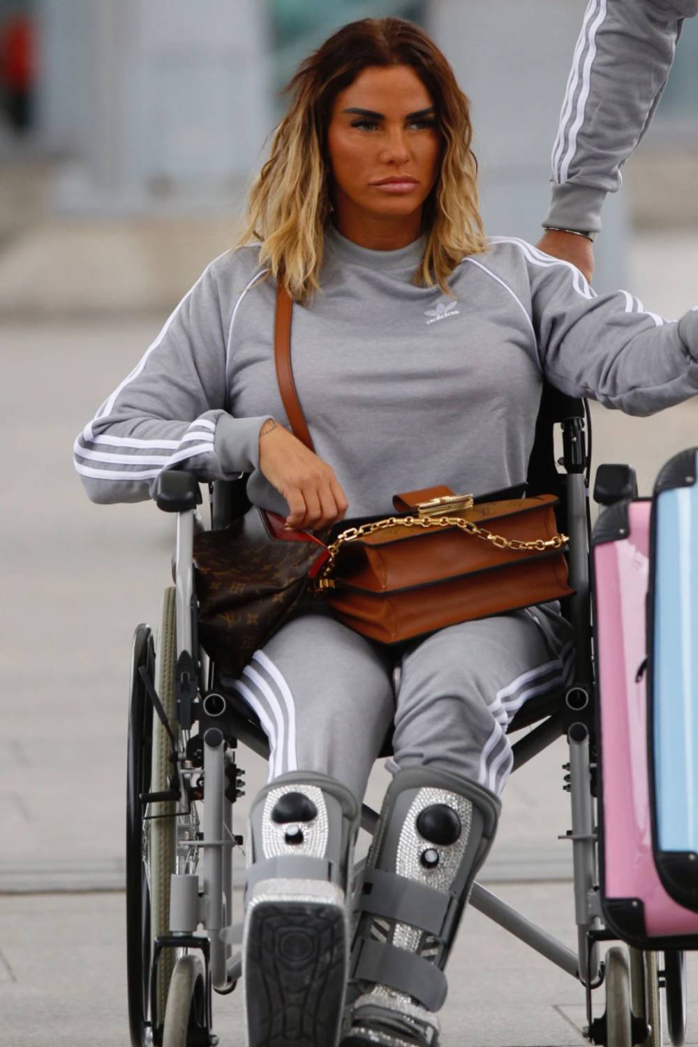 Katie Price sits in a wheelchair