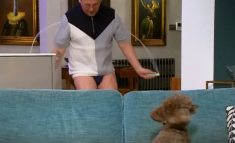 Stephen skipping in his living room wearing his pants