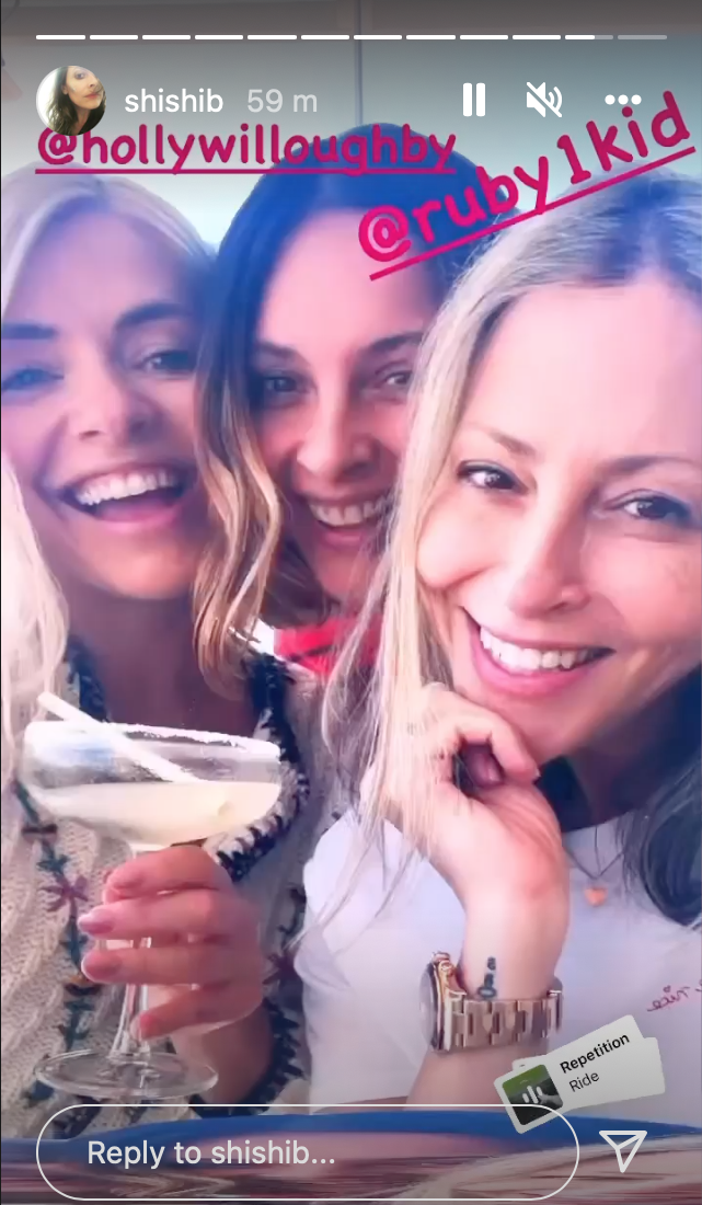 Holly Willoughby posing with a cocktail