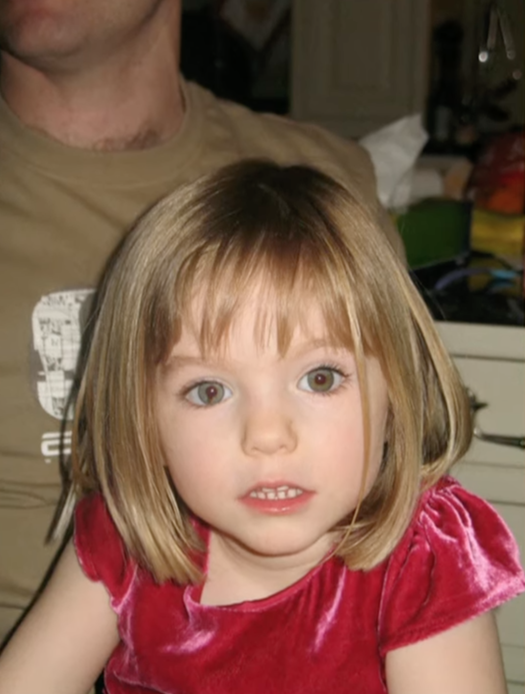 Madeleine McCann wearing a pink dress