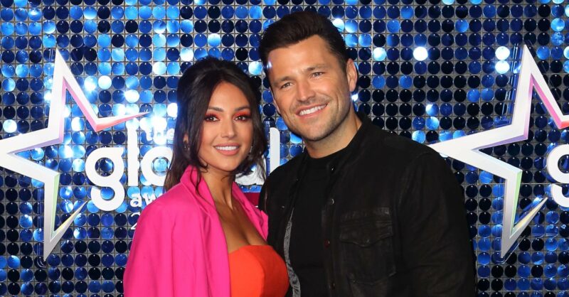 Michelle Keegan and husband Mark Wright smiling on the red carpet