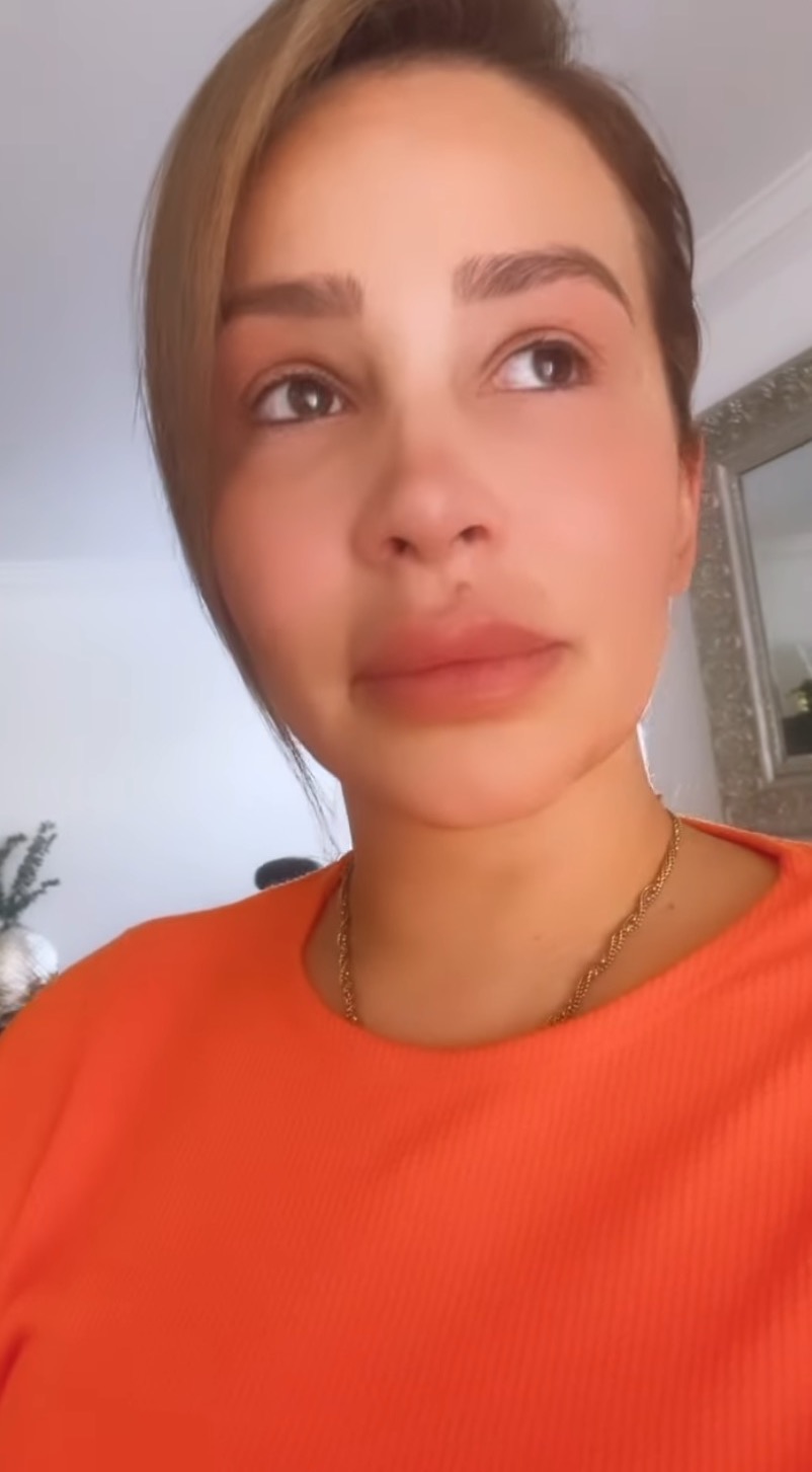 Safiyya Vorajee crying in an orange top